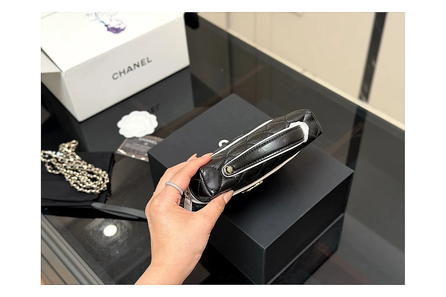 Chanel Wallet On Chain Black shopping brief photo showing black quilted leather wallet body, chain strap, flap closure, and compact shoulder-bag profile thumbnail 5