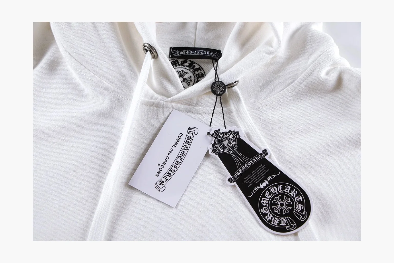 Chrome Hearts White Cross Zip Hoodie shopping brief photo showing white cotton fleece zip hoodie, cross back artwork, drawcord hood, sleeve print, front zipper, and ribbed trim thumbnail 5