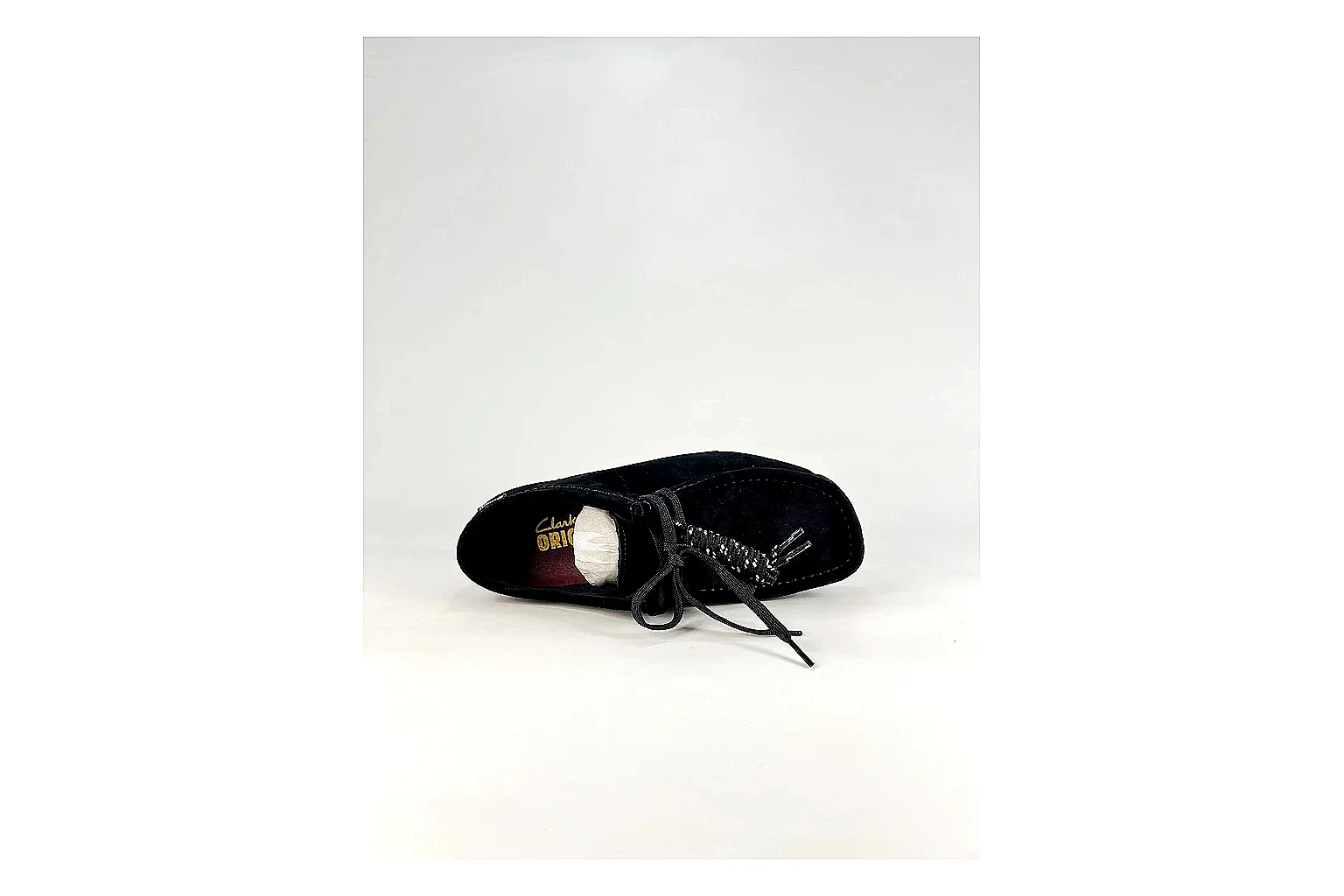 Clarks Wallabee Black Sneakers shopping brief image showing black suede Wallabee shoes with suede texture, side-profile shape, upper panel lines, and outsole detail thumbnail 5