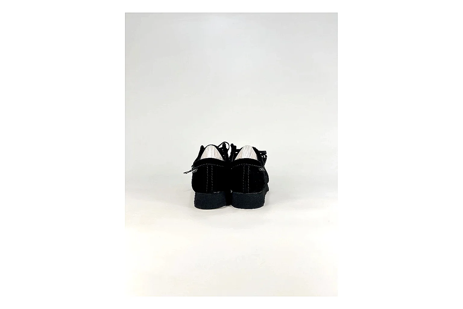 Clarks Wallabee Black Sneakers shopping brief image showing black suede Wallabee shoes with suede texture, side-profile shape, upper panel lines, and outsole detail thumbnail 6