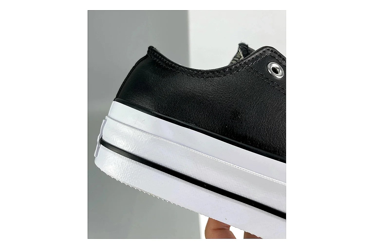 Converse All Star Lift Black Platform Low Top shopping brief photo showing black leather low-top upper, silver eyelets, white rubber toe cap, and elevated striped platform sole thumbnail 3
