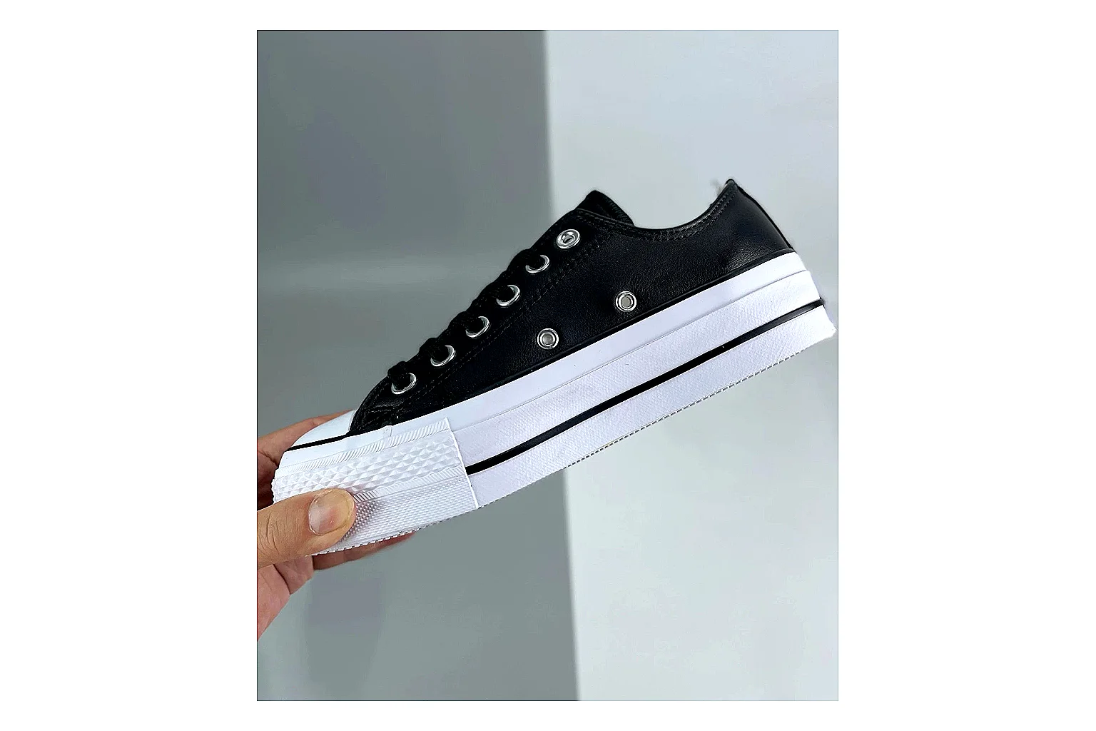 Converse All Star Lift Black Platform Low Top shopping brief photo showing black leather low-top upper, silver eyelets, white rubber toe cap, and elevated striped platform sole thumbnail 6