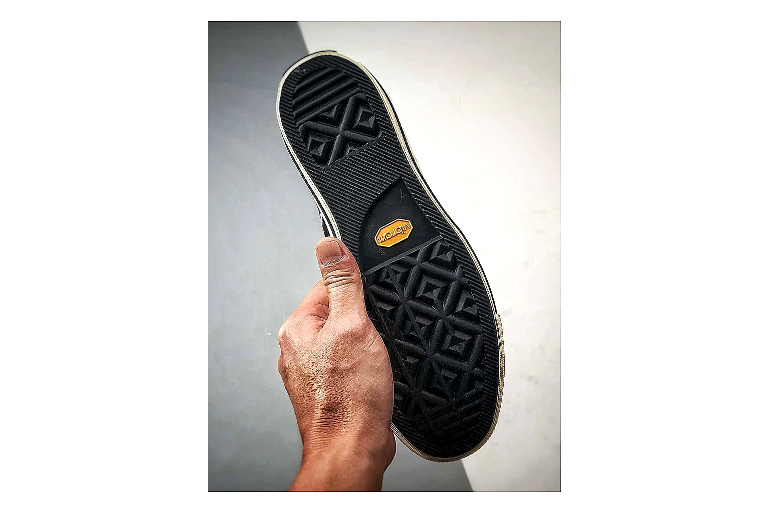 Converse Chuck Low Black White shopping brief photo showing black canvas low-top upper, white rubber toe cap, metal eyelets, and classic Converse sole thumbnail 3