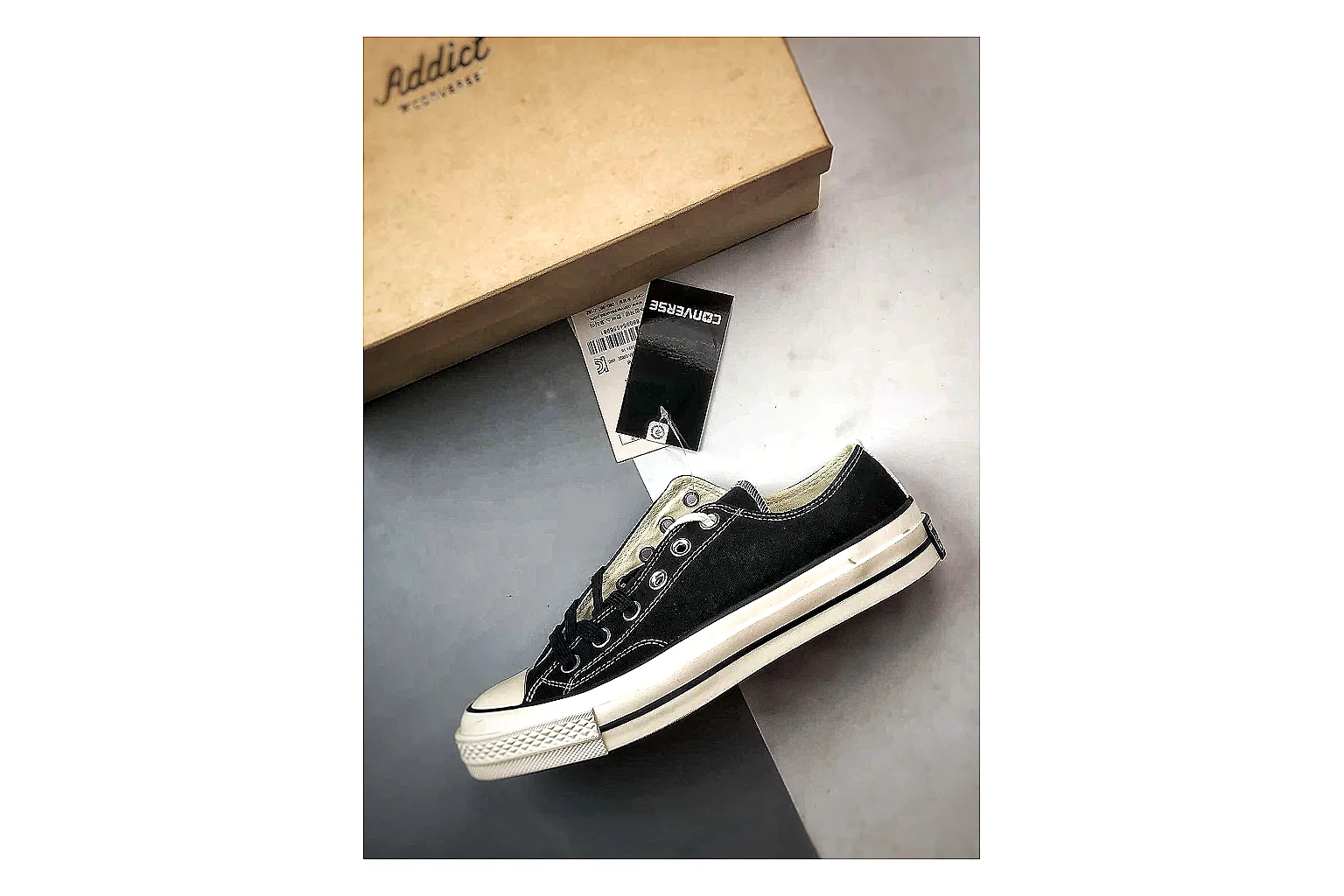 Converse Chuck Low Black White shopping brief photo showing black canvas low-top upper, white rubber toe cap, metal eyelets, and classic Converse sole thumbnail 5