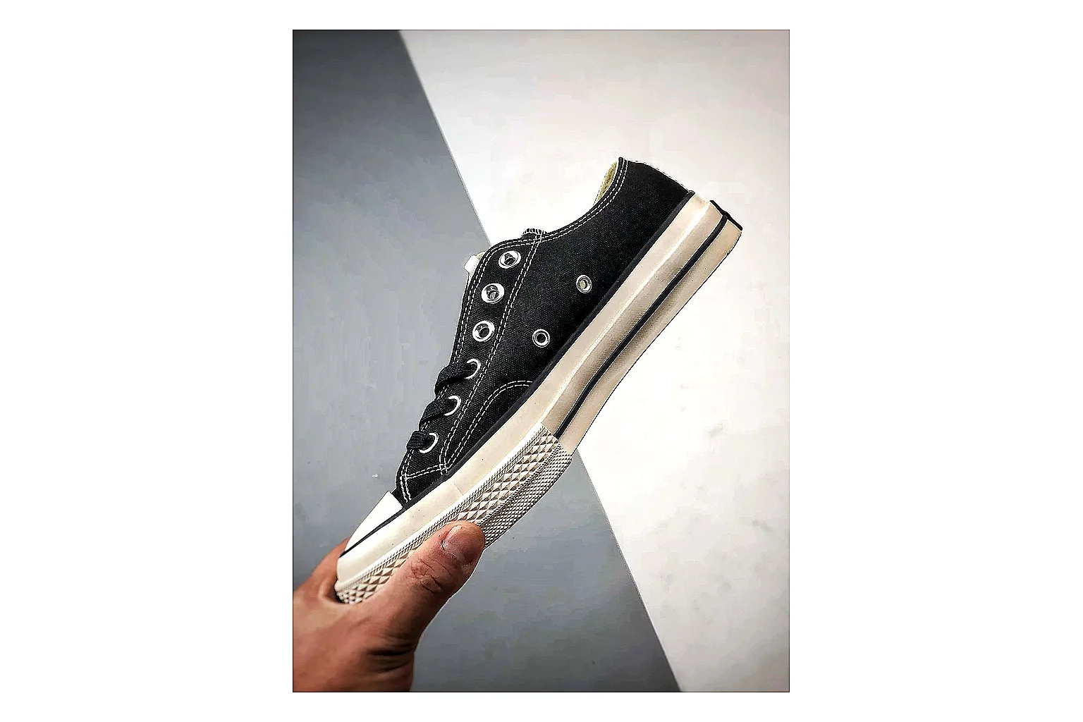 Converse Chuck Low Black White shopping brief photo showing black canvas low-top upper, white rubber toe cap, metal eyelets, and classic Converse sole thumbnail 6