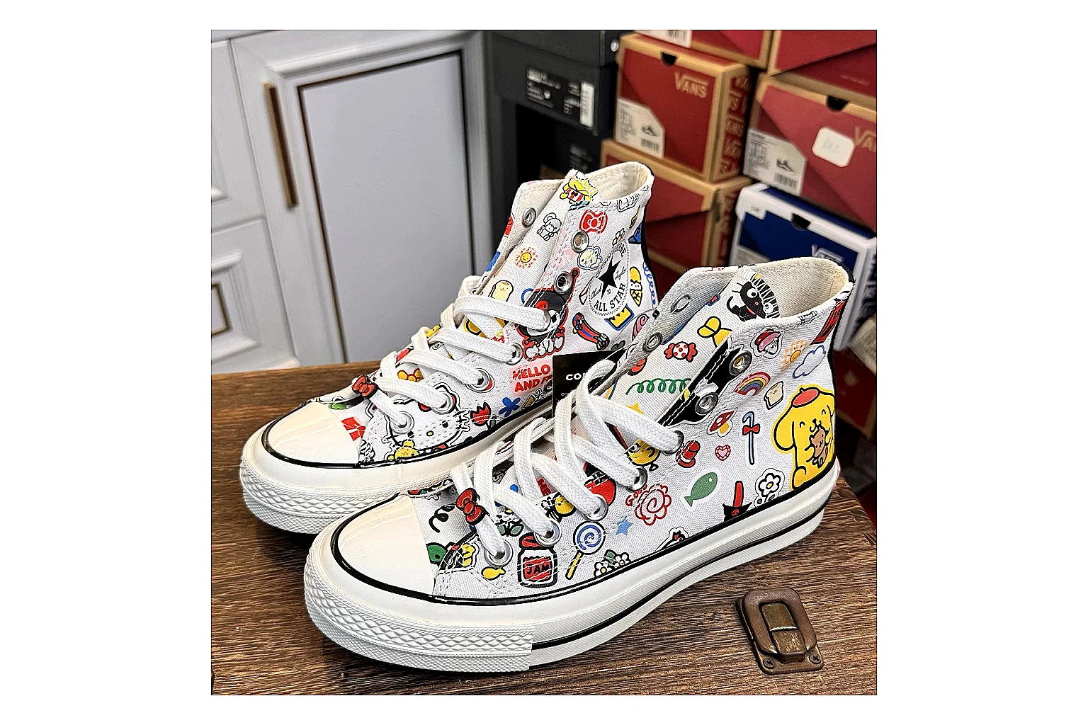 Converse Hello Kitty Chuck 70 High Top shopping brief photo showing white canvas high-top upper, colorful character graphics, metal eyelets, rubber toe cap, and elevated vintage sole thumbnail 4