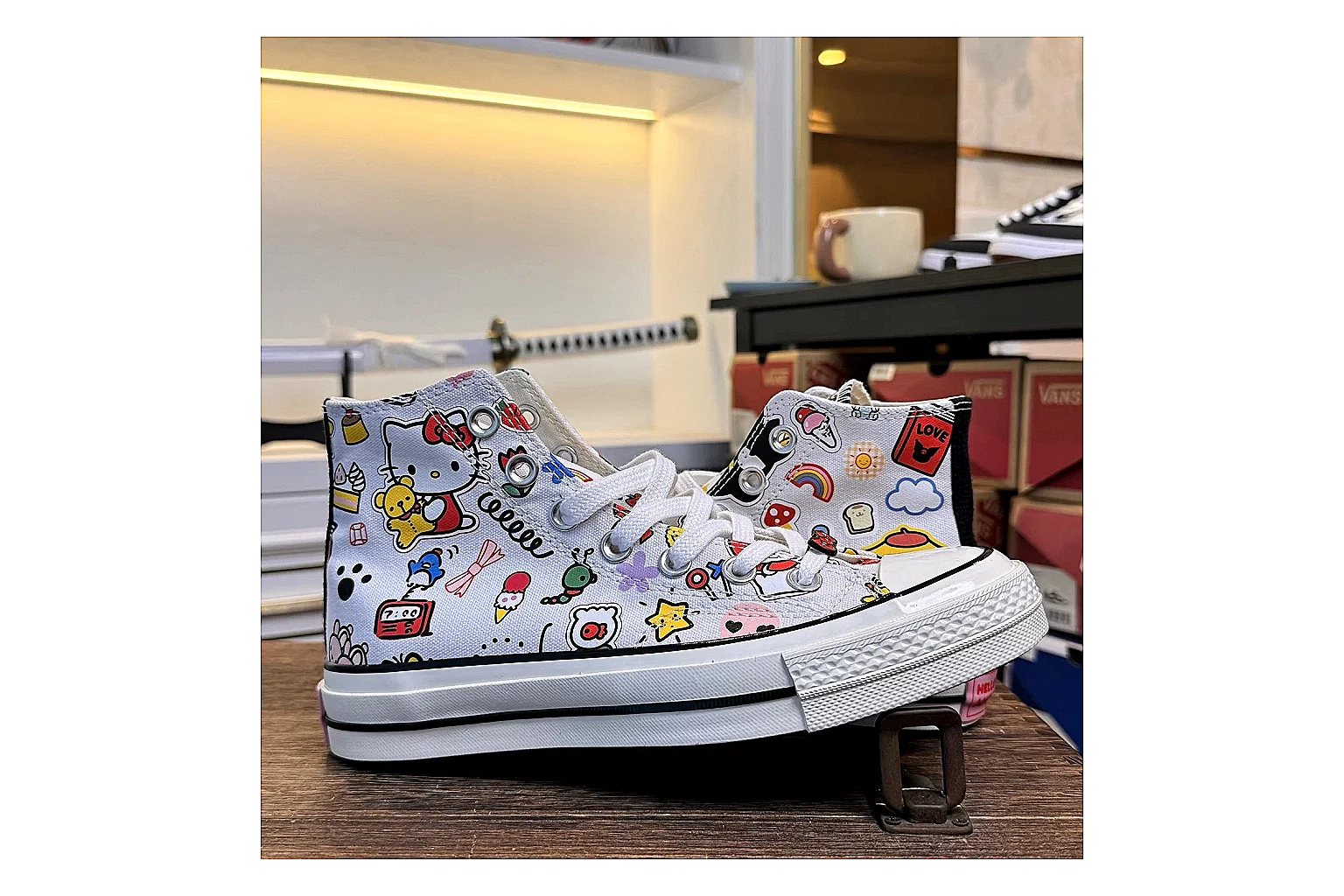 Converse Hello Kitty Chuck 70 High Top shopping brief photo showing white canvas high-top upper, colorful character graphics, metal eyelets, rubber toe cap, and elevated vintage sole thumbnail 5