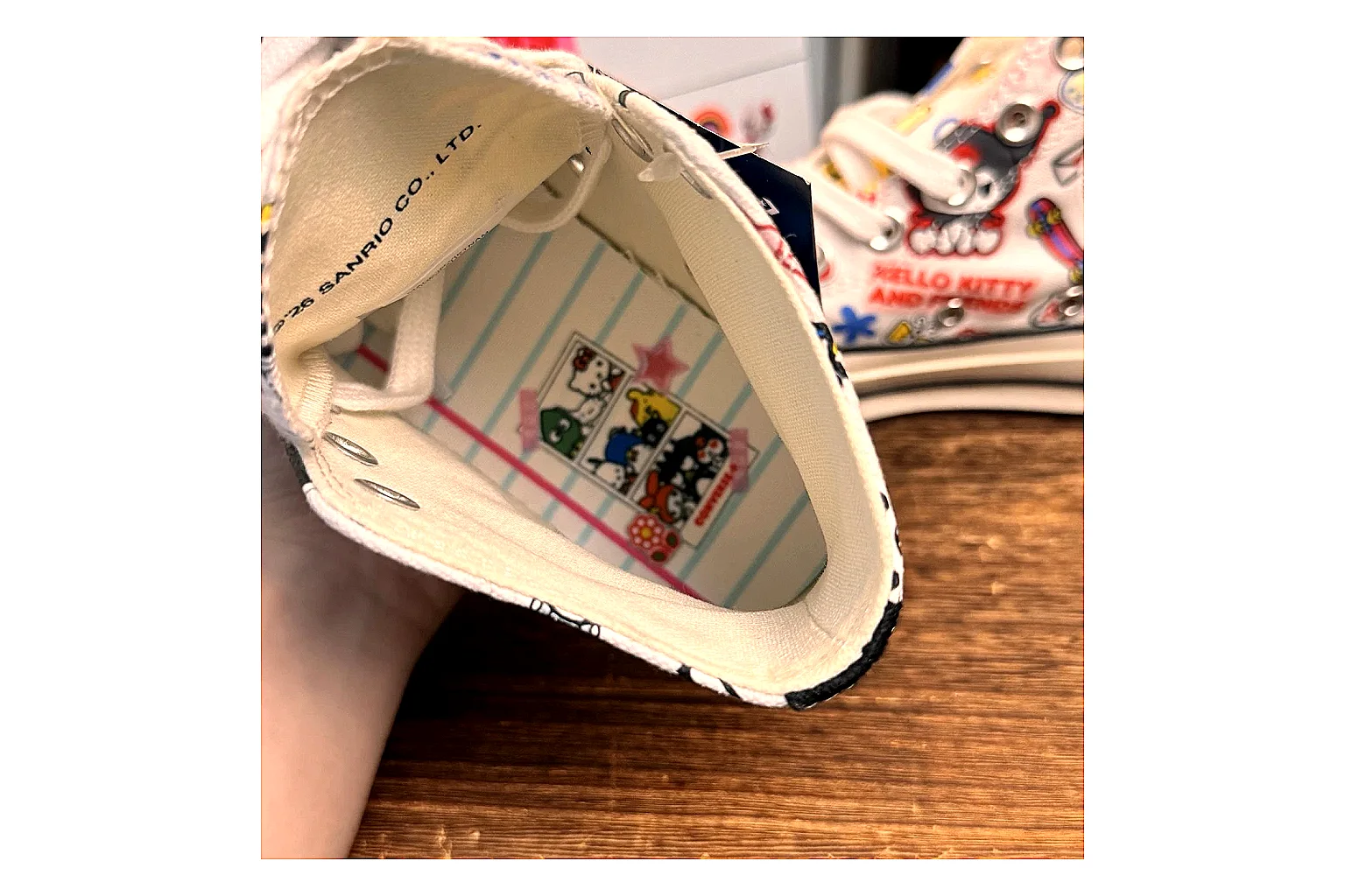 Converse Hello Kitty Chuck 70 High Top shopping brief photo showing white canvas high-top upper, colorful character graphics, metal eyelets, rubber toe cap, and elevated vintage sole thumbnail 6