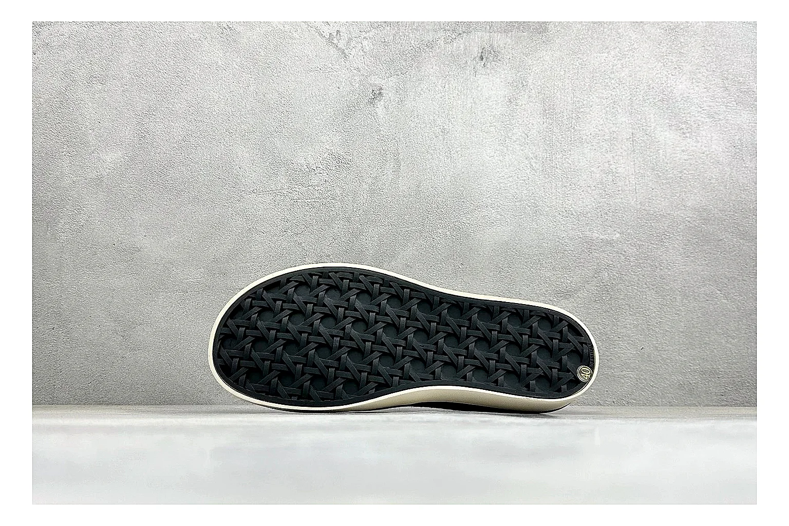 Dior Act Slide Black Low-Top shopping brief photo showing black monogram-style upper, low slip-on shape, chunky dark sole, and luxury casual profile thumbnail 2
