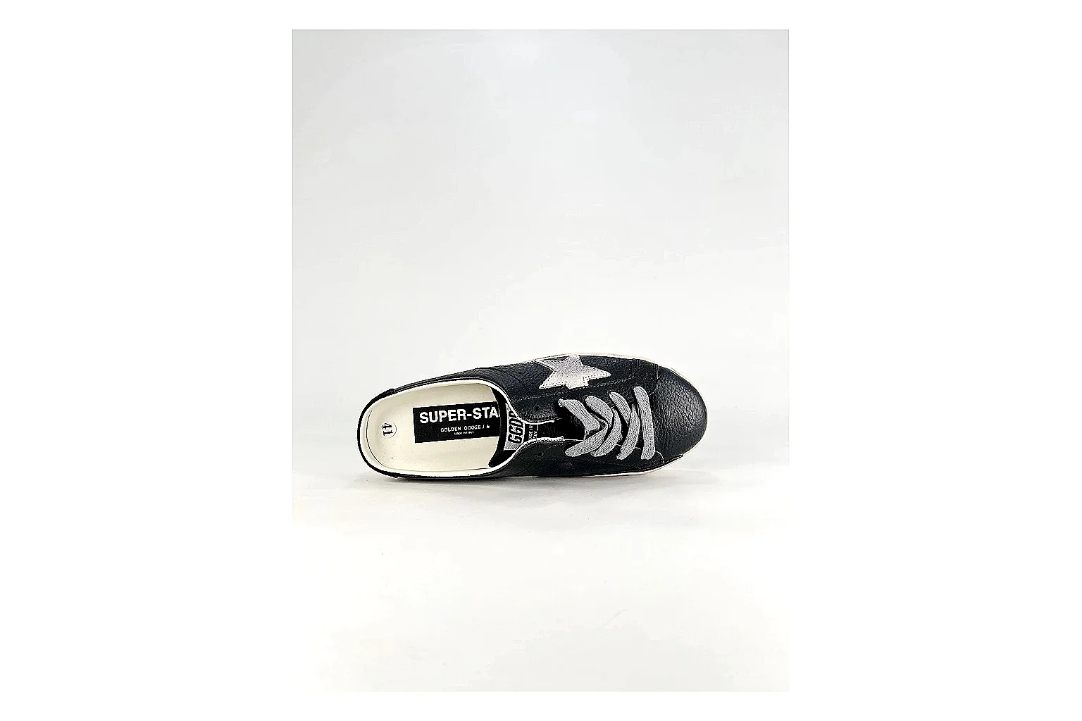 GGDB Super-Star Black White Sneakers shopping brief image showing black white distressed low-top sneakers with leather texture, side-profile shape, upper panel lines, and outsole detail thumbnail 6