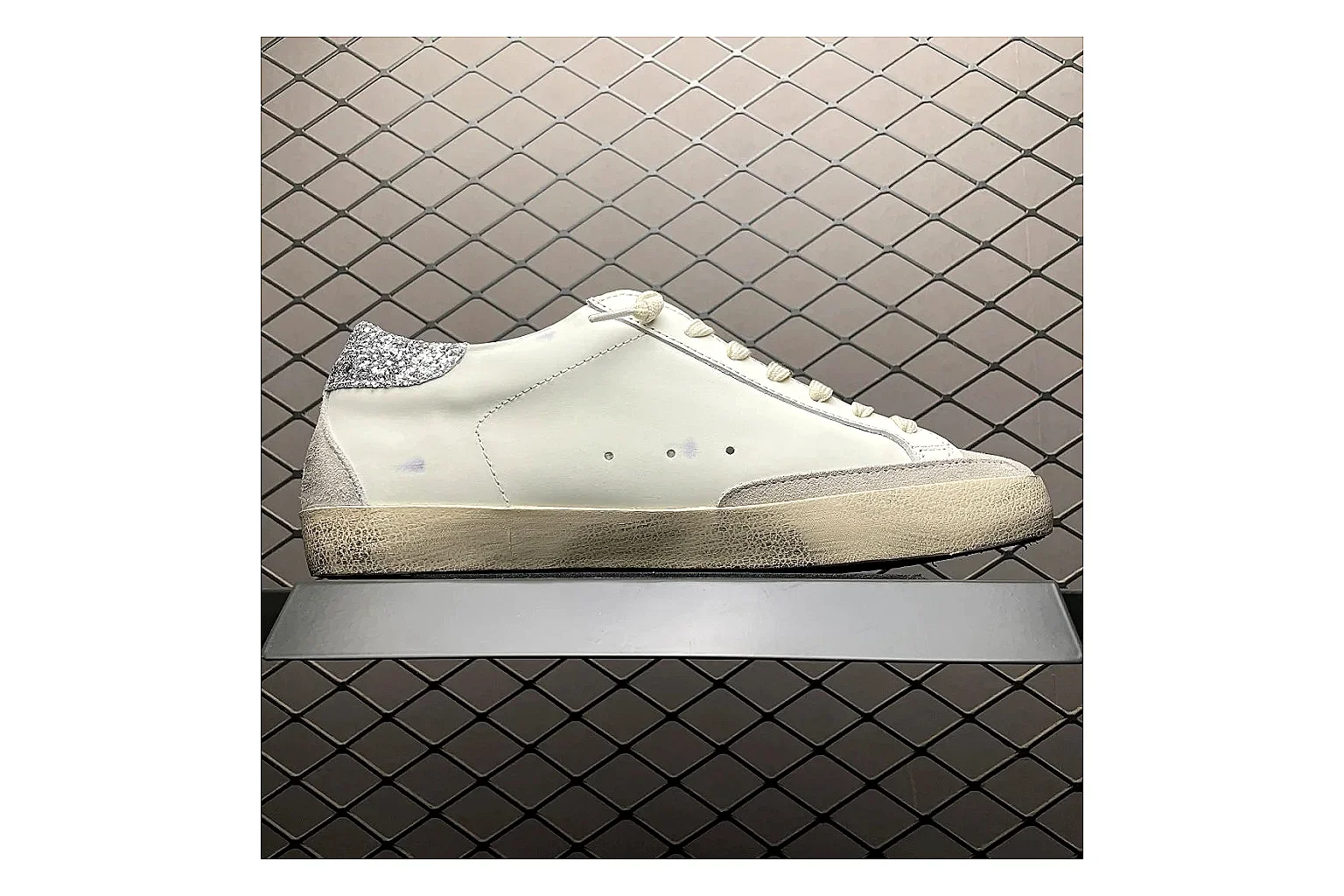 Golden Goose Super-Star White Silver shopping brief image showing white silver gold super-star distressed low-top with mixed upper and low top shape