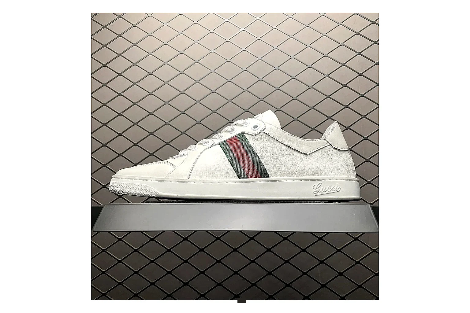 Gucci Ace White Web Stripe Sneaker shopping brief image showing white red gold ace web-stripe low-top with leather upper and low top shape