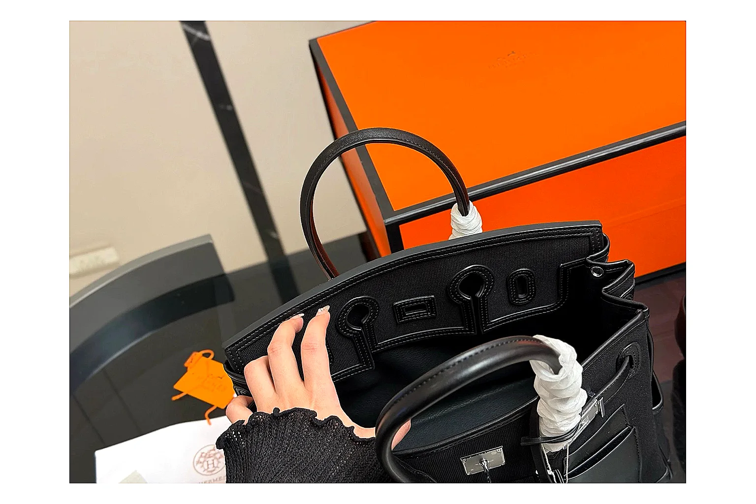 Hermes Birkin Style Black shopping brief photo showing black leather structured body, top handles, flap-and-strap shape, and polished hardware thumbnail 2