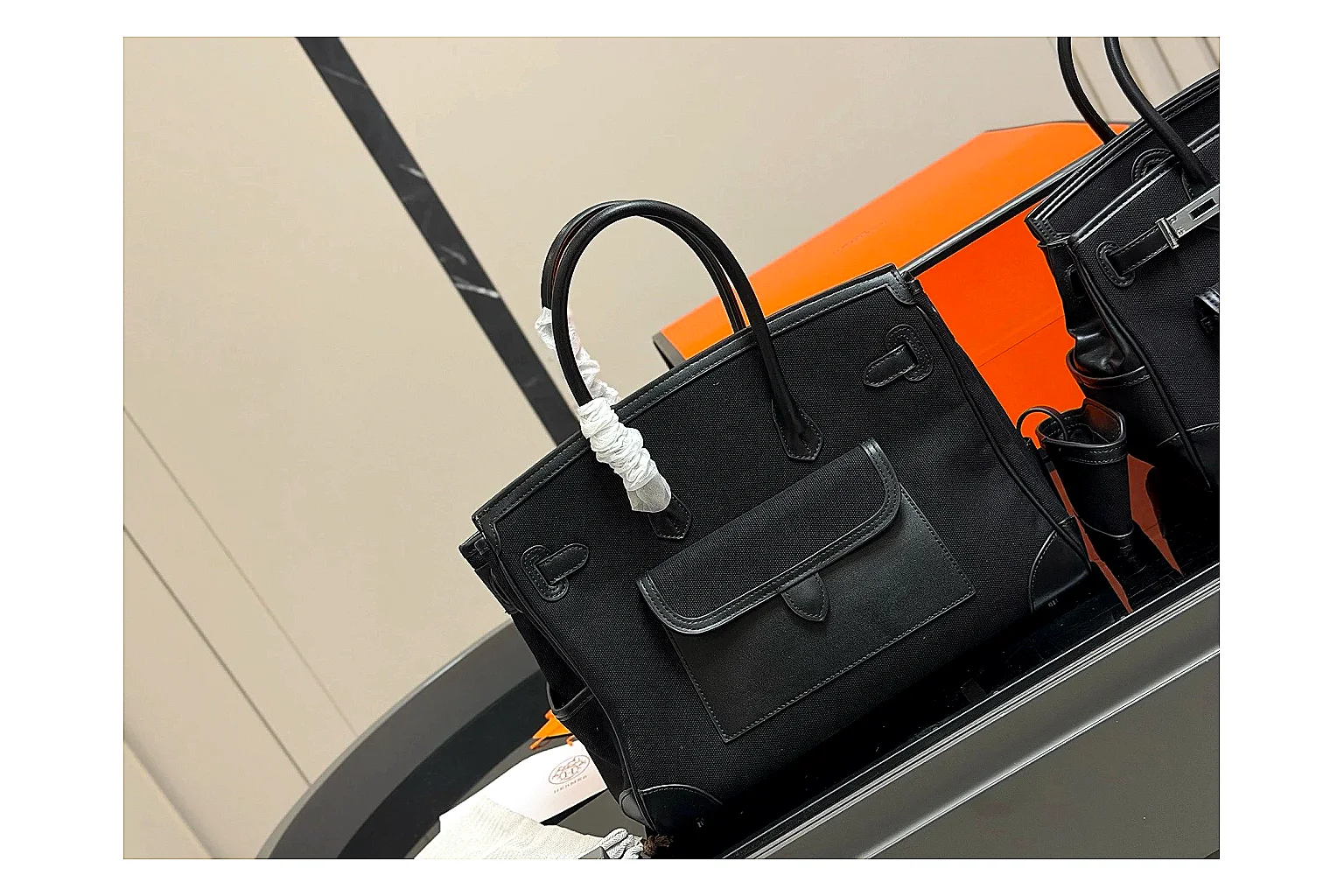 Hermes Birkin Style Black shopping brief photo showing black leather structured body, top handles, flap-and-strap shape, and polished hardware thumbnail 3