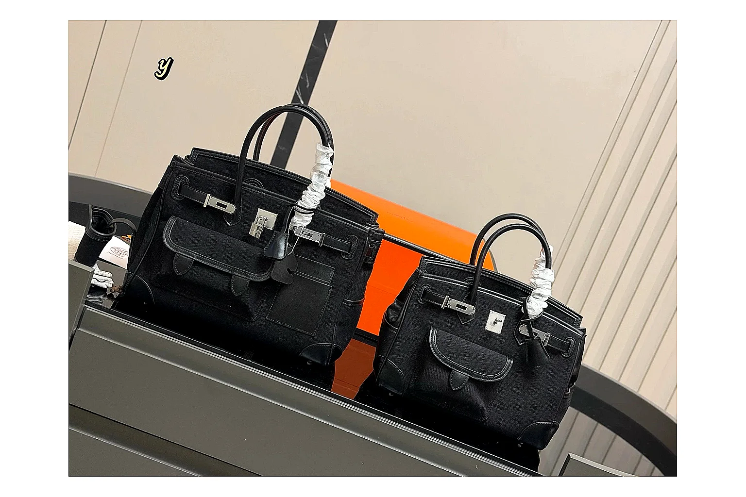 Hermes Birkin Style Black shopping brief photo showing black leather structured body, top handles, flap-and-strap shape, and polished hardware thumbnail 4