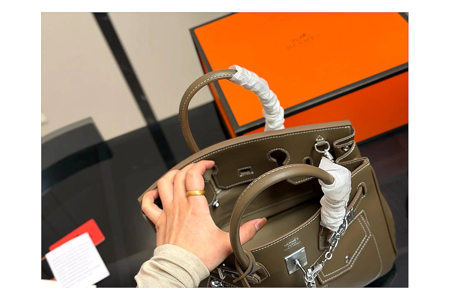 Hermes Birkin Style Olive shopping brief photo showing olive leather structured body, top handles, flap-and-strap shape, and polished hardware thumbnail 2