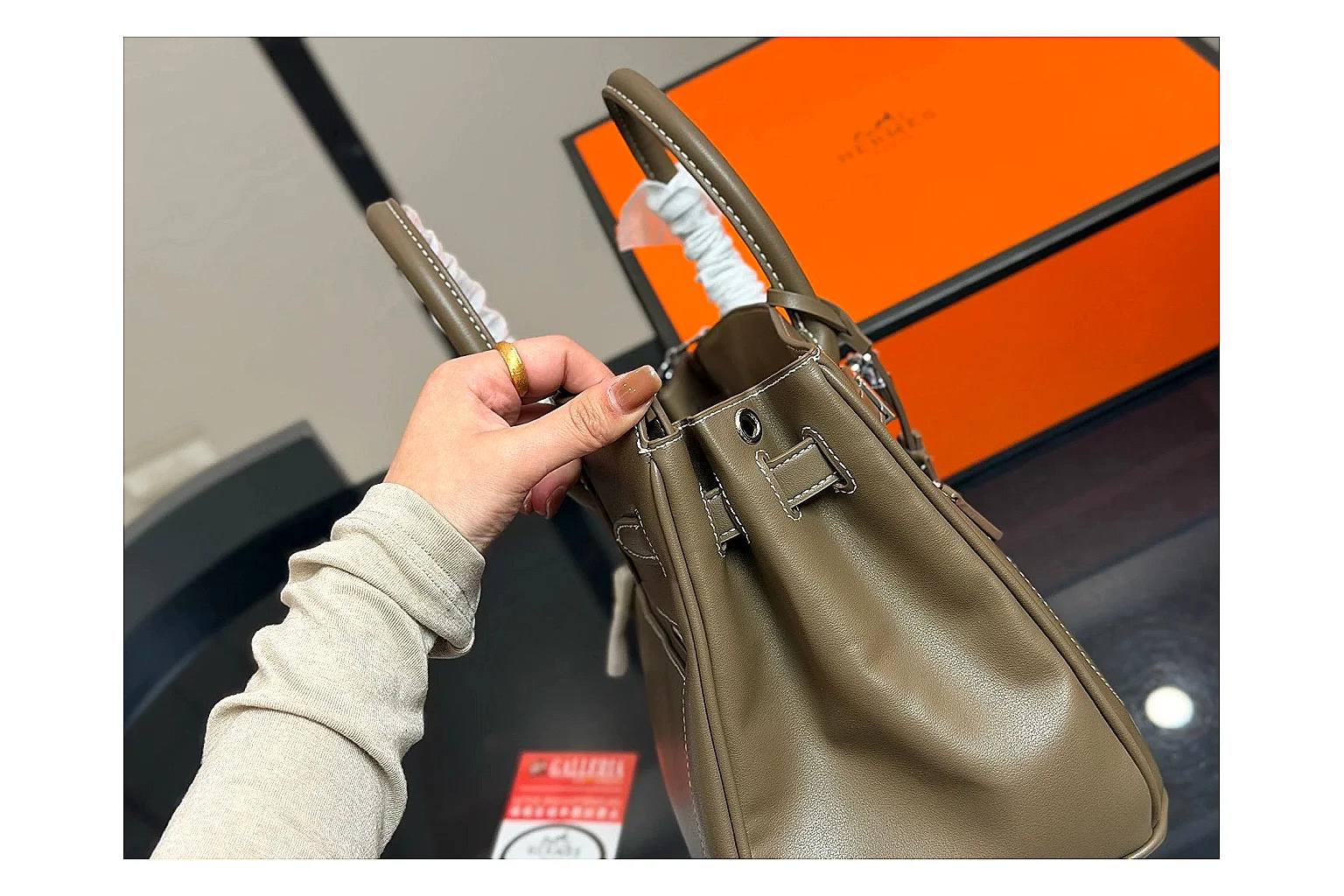 Hermes Birkin Style Olive shopping brief photo showing olive leather structured body, top handles, flap-and-strap shape, and polished hardware thumbnail 6