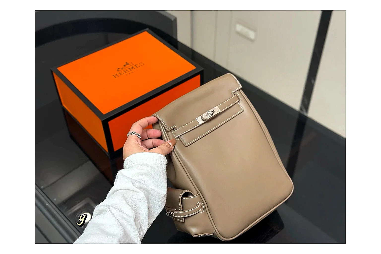Hermes Kelly Backpack Beige shopping brief photo showing beige leather backpack body, Kelly-style flap, top handle, shoulder straps, and polished hardware thumbnail 4