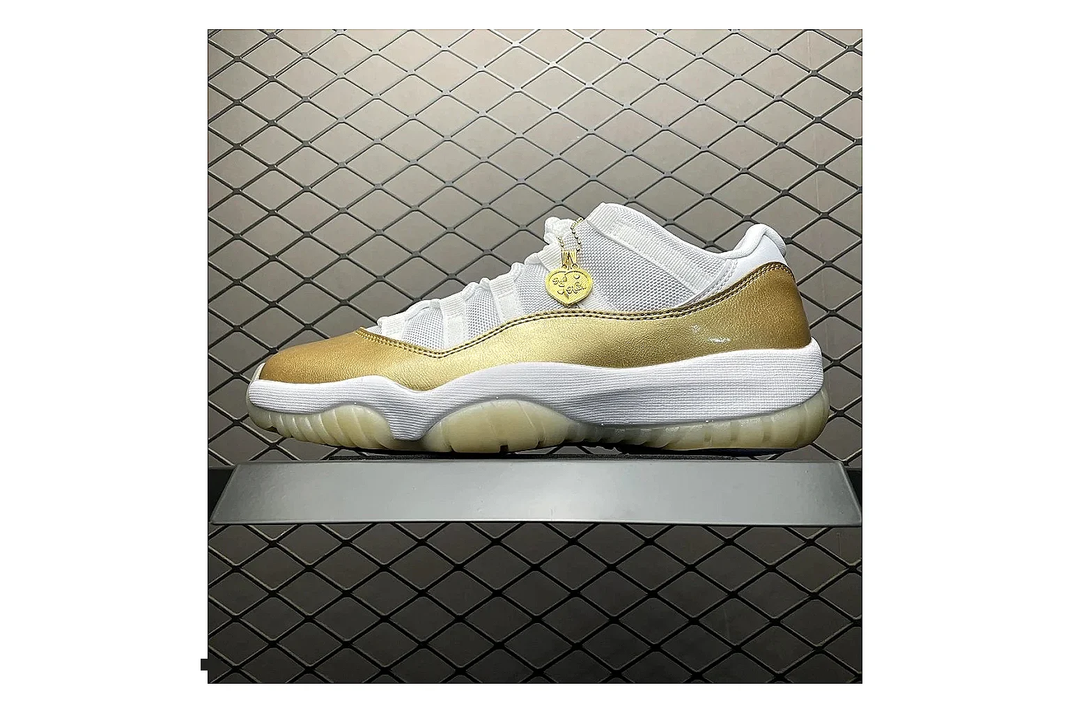 Jordan 11 Low White Gold Sneaker shopping brief image showing white gold aj11 low sneaker with mixed upper and low top shape