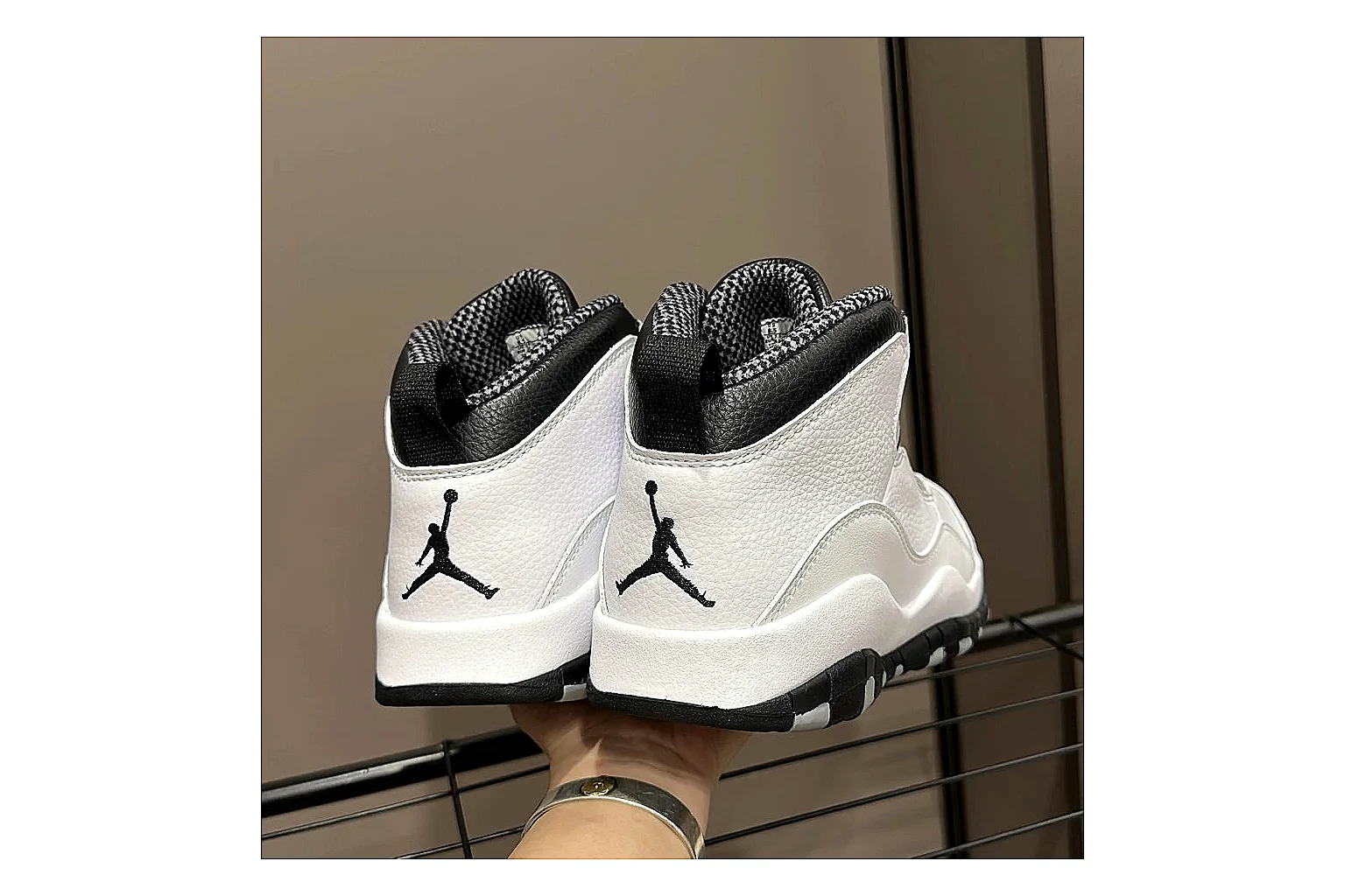 Jordan Air Jordan 10 Steel White Black shopping brief photo showing white and black high-top court upper, striped lace panels, Jumpman heel branding, and retro sole thumbnail 2
