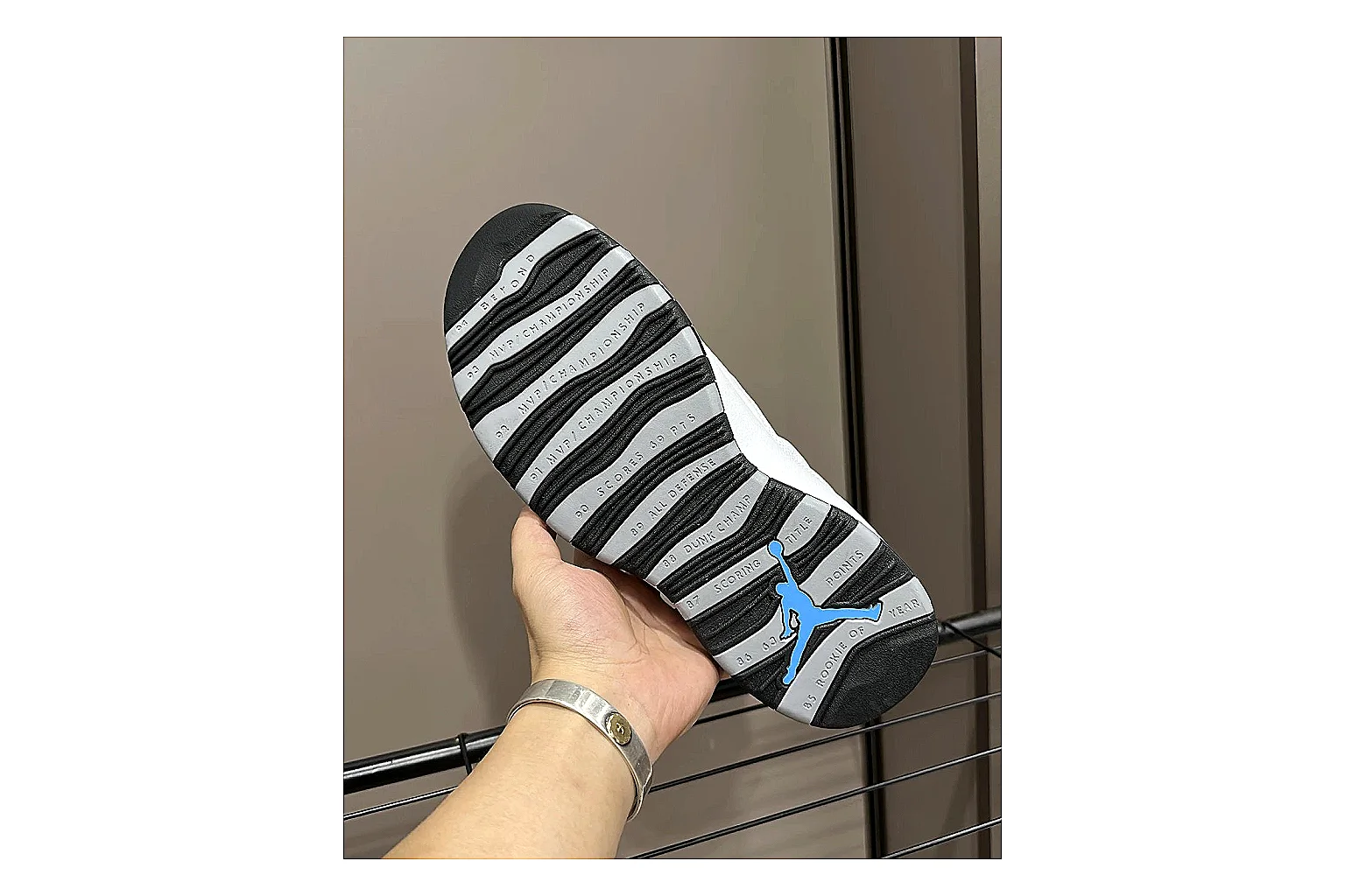 Jordan Air Jordan 10 Steel White Black shopping brief photo showing white and black high-top court upper, striped lace panels, Jumpman heel branding, and retro sole thumbnail 3