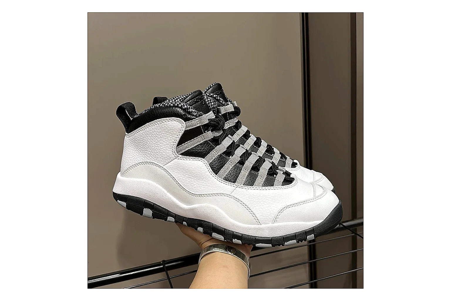 Jordan Air Jordan 10 Steel White Black shopping brief photo showing white and black high-top court upper, striped lace panels, Jumpman heel branding, and retro sole thumbnail 4