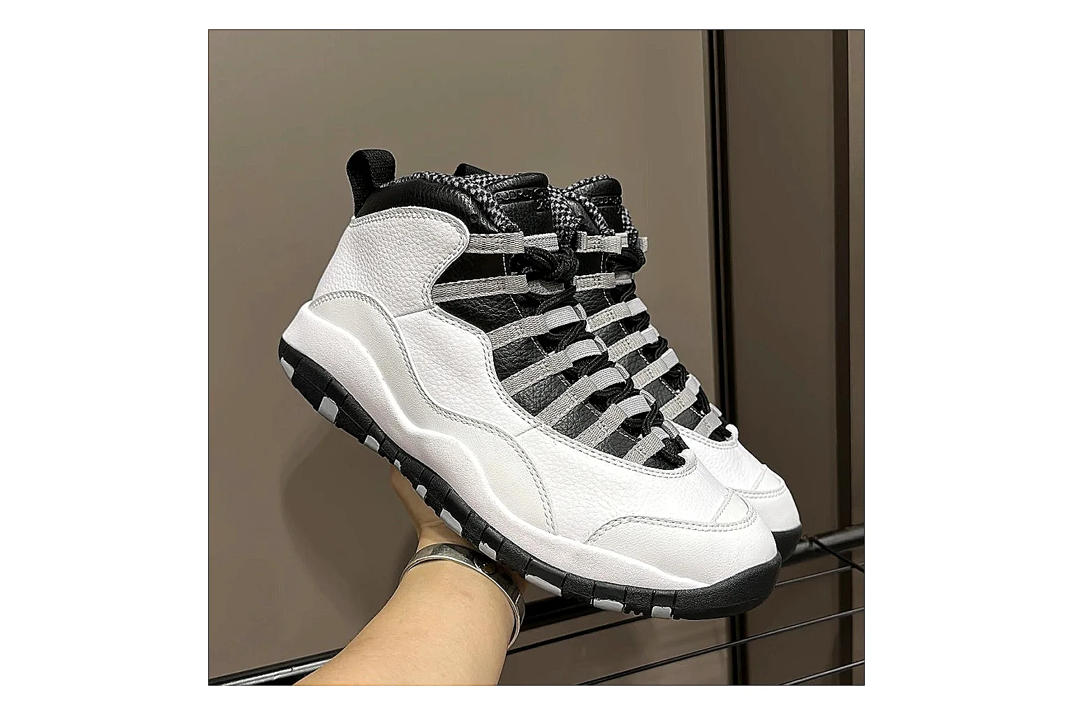 Jordan Air Jordan 10 Steel White Black shopping brief photo showing white and black high-top court upper, striped lace panels, Jumpman heel branding, and retro sole thumbnail 5