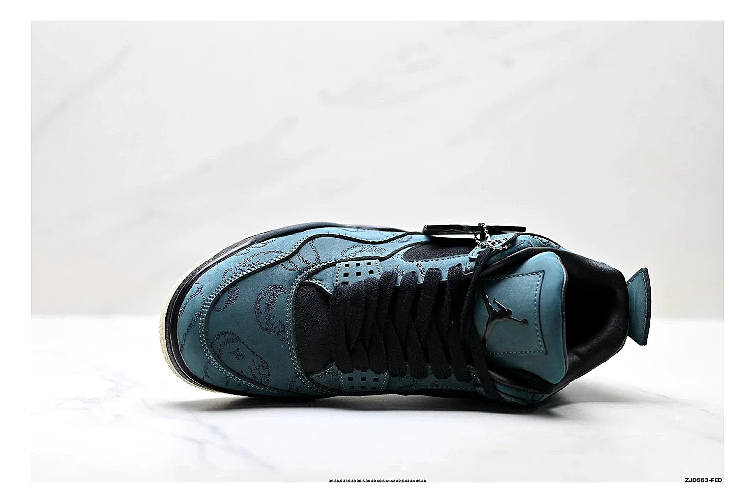 Jordan Air Jordan 4 Teal Black Sneakers shopping brief image showing teal black retro basketball sneakers with nubuck texture, side-profile shape, upper panel lines, and outsole detail thumbnail 5
