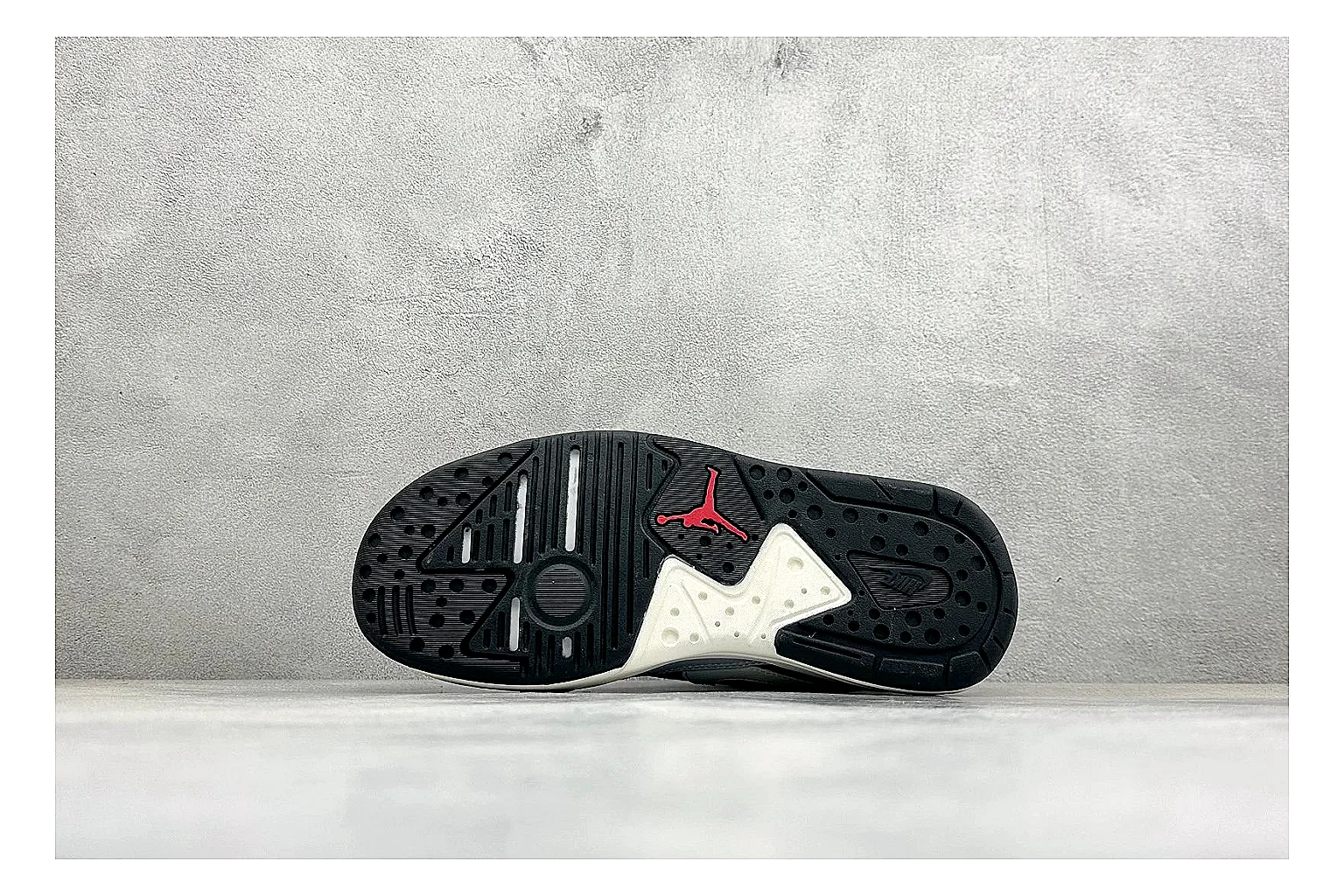 Jordan CMFT Black White shopping brief photo showing black and white layered panels, low padded collar, visible Jordan styling cues, and a compact court sole thumbnail 2
