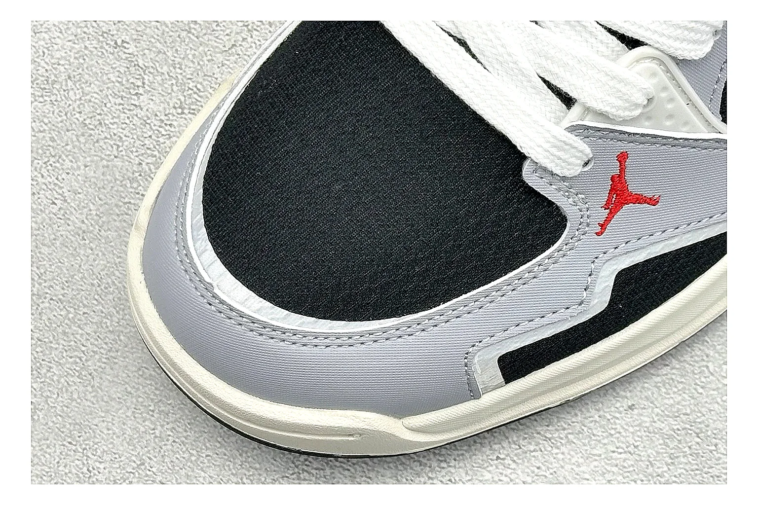 Jordan CMFT Black White shopping brief photo showing black and white layered panels, low padded collar, visible Jordan styling cues, and a compact court sole thumbnail 3