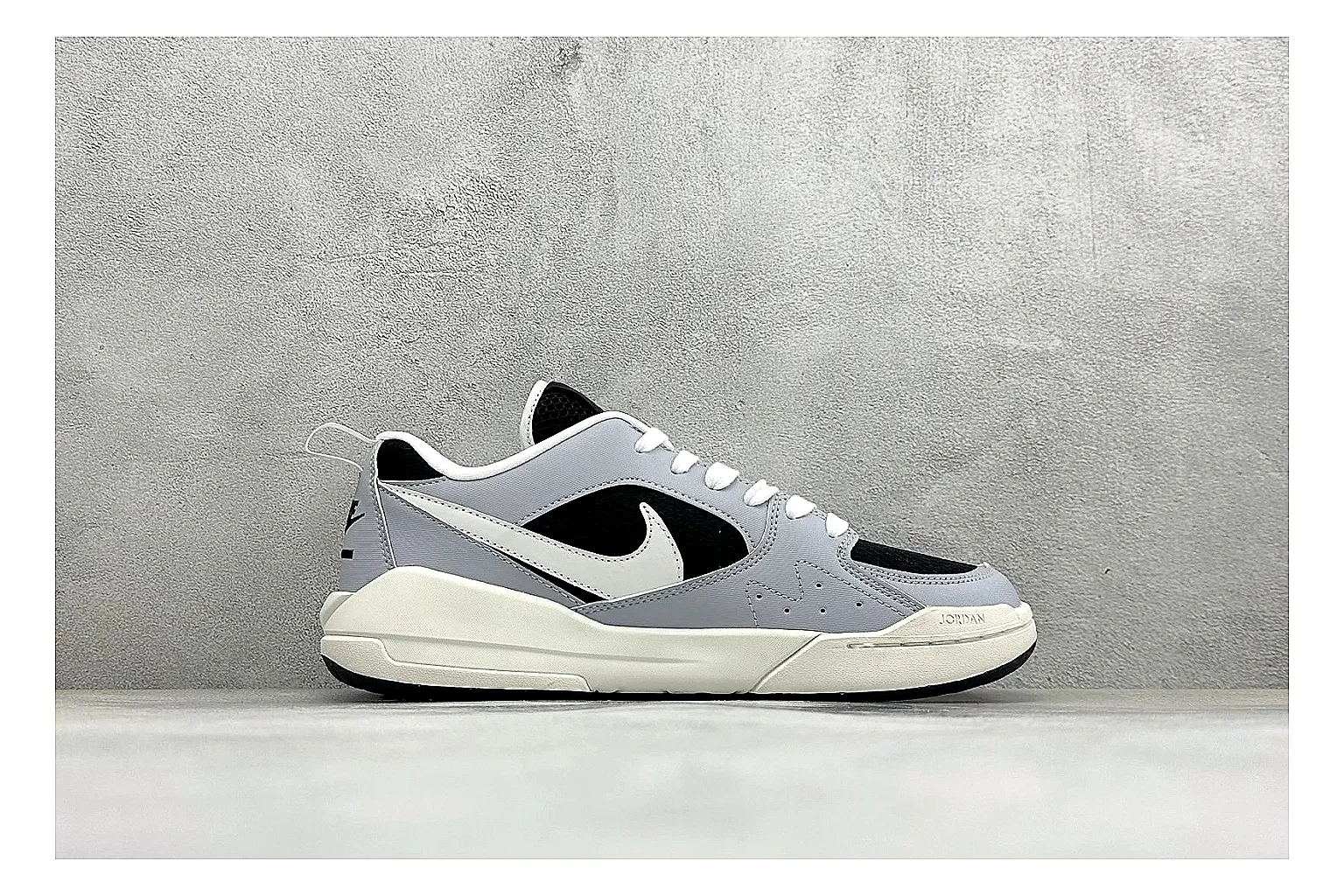 Jordan CMFT Black White shopping brief photo showing black and white layered panels, low padded collar, visible Jordan styling cues, and a compact court sole thumbnail 4