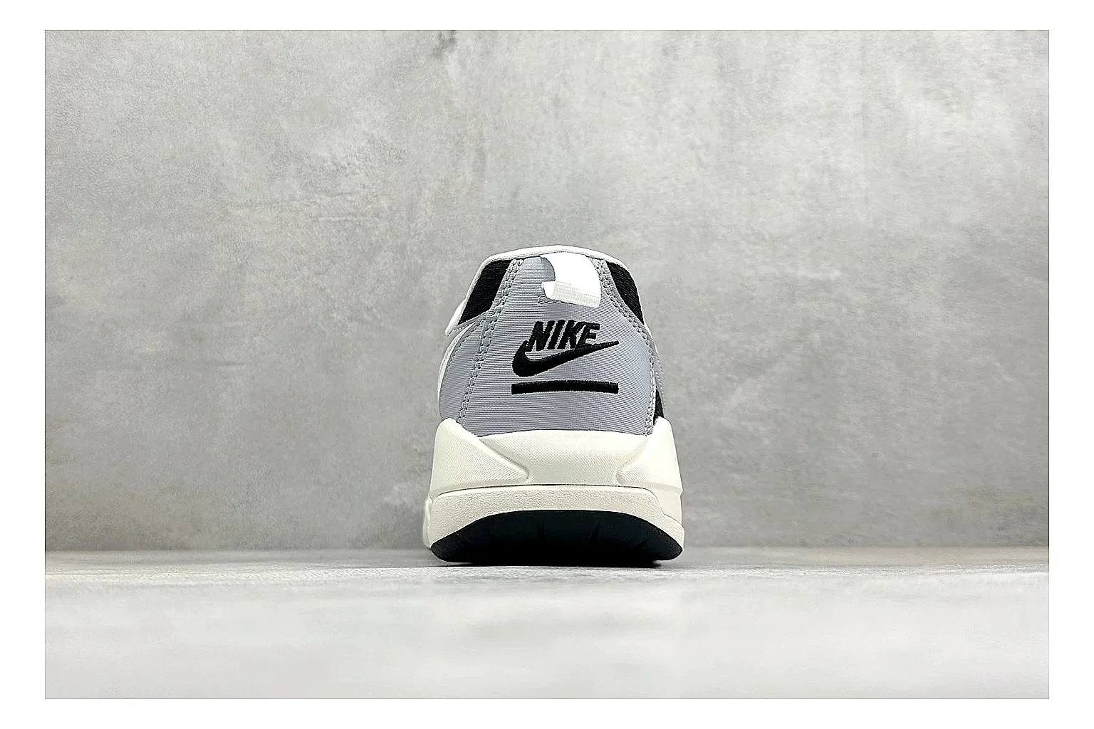 Jordan CMFT Black White shopping brief photo showing black and white layered panels, low padded collar, visible Jordan styling cues, and a compact court sole thumbnail 6