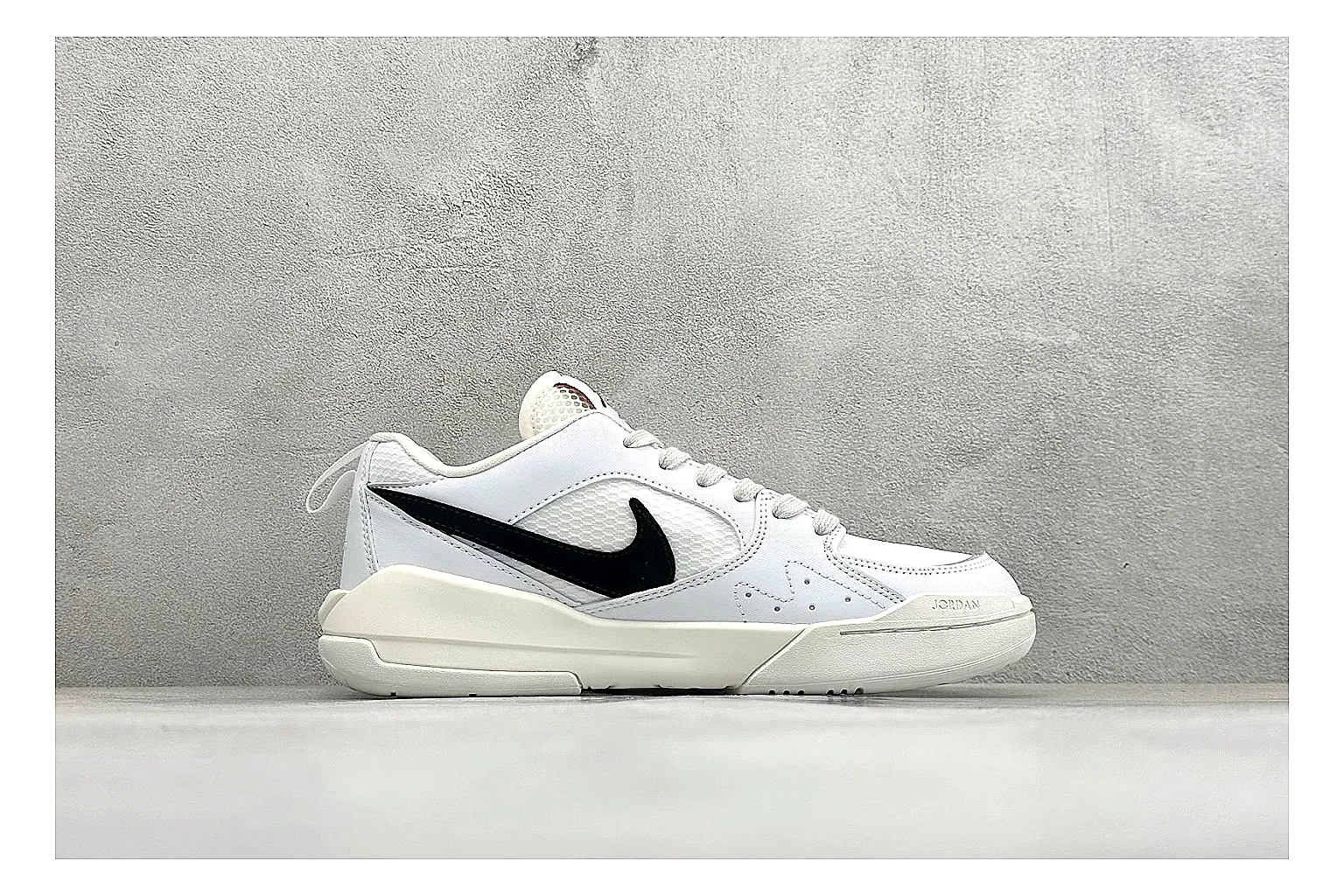 Jordan CMFT White Black shopping brief photo showing white and black layered court panels, red logo detail, low collar, and a clean contrast sole thumbnail 4