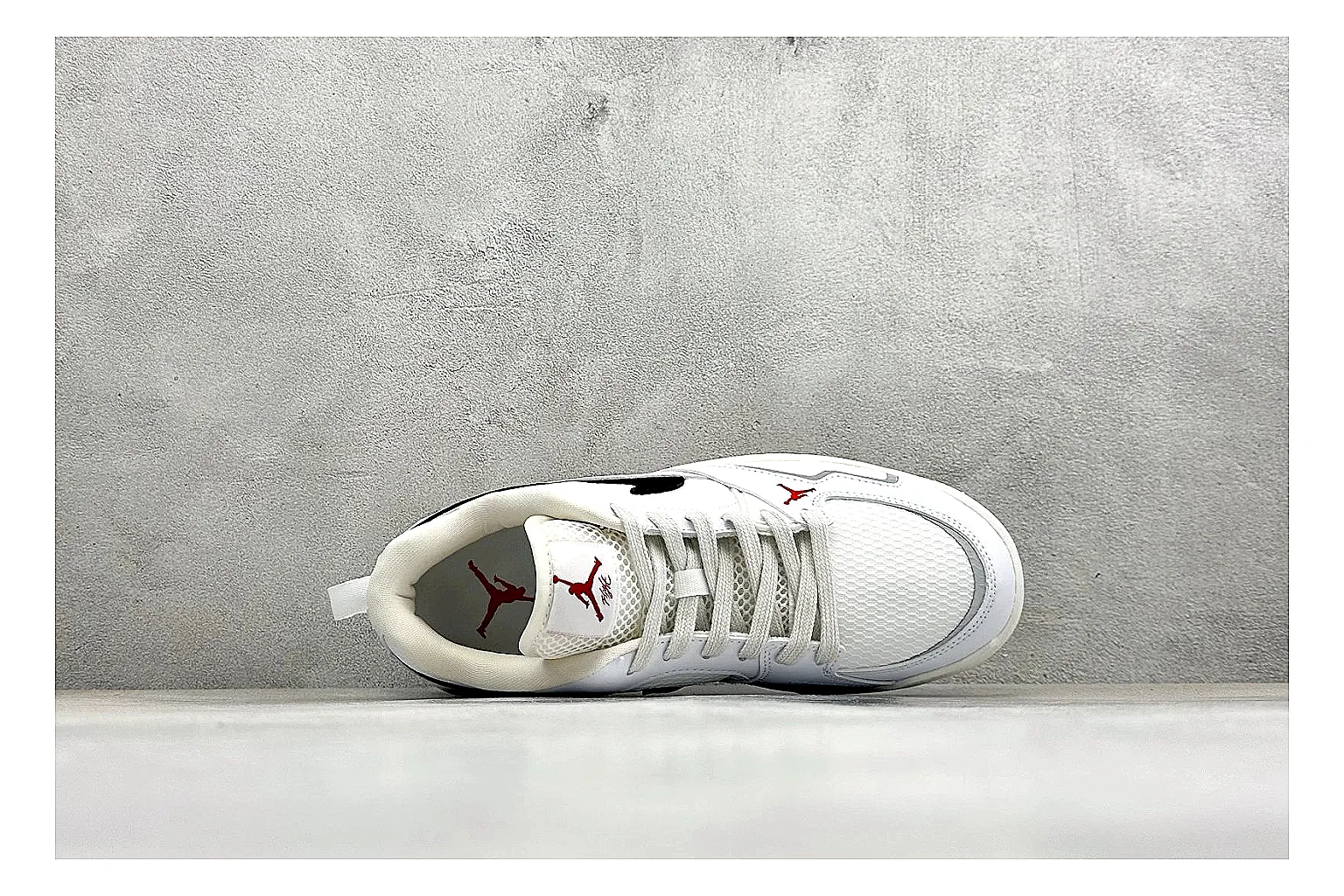 Jordan CMFT White Black shopping brief photo showing white and black layered court panels, red logo detail, low collar, and a clean contrast sole thumbnail 5