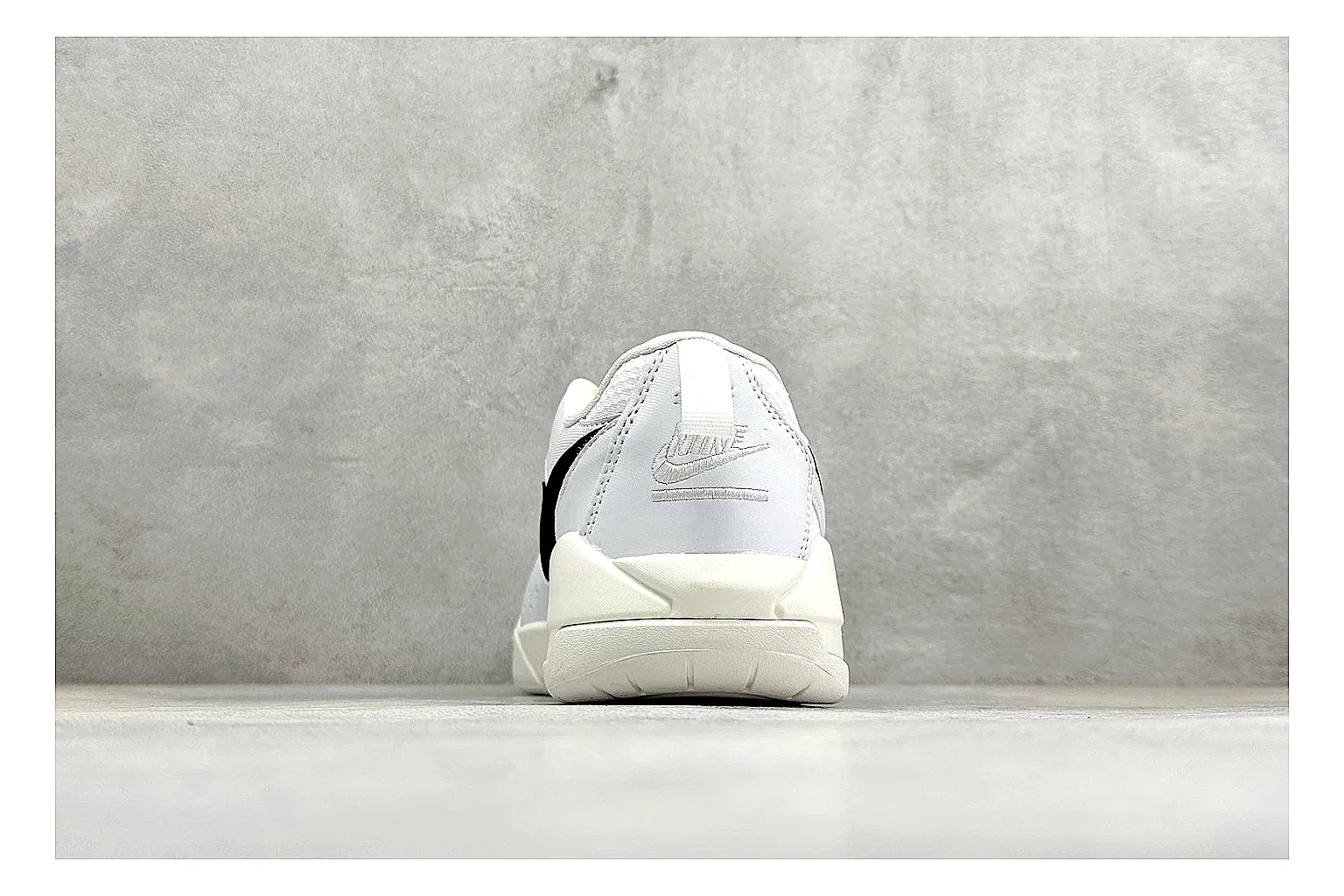 Jordan CMFT White Black shopping brief photo showing white and black layered court panels, red logo detail, low collar, and a clean contrast sole thumbnail 6