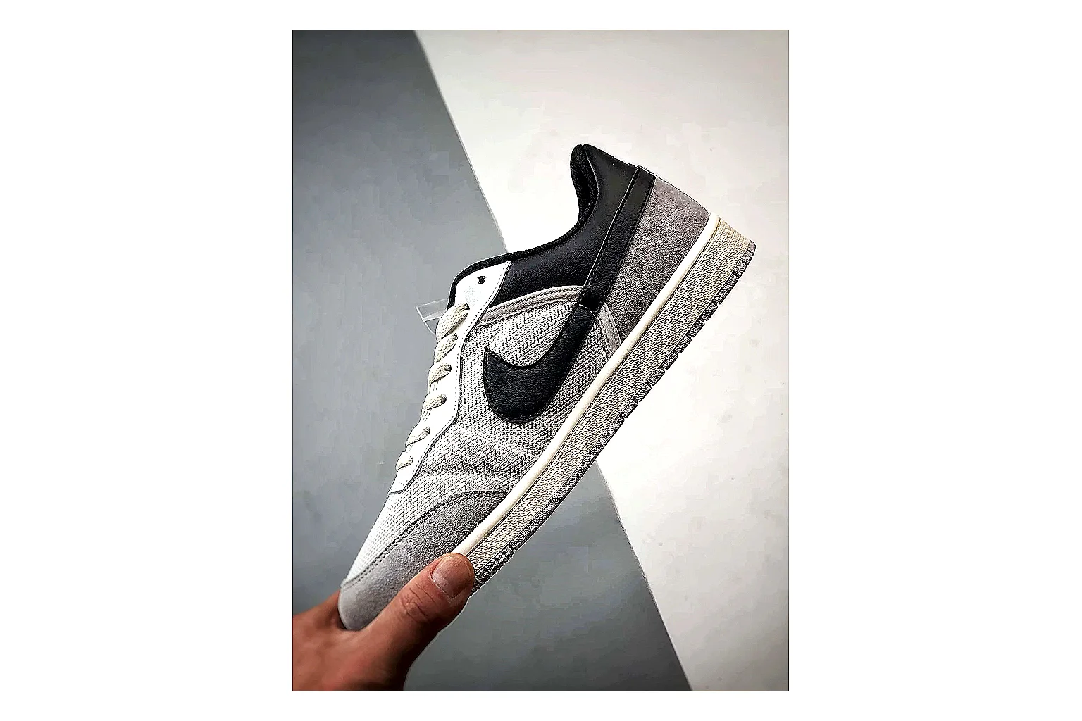 Jordan Low Black White Sneaker shopping brief image showing white black low-top sneaker with mixed-material upper and low-profile shape thumbnail 3