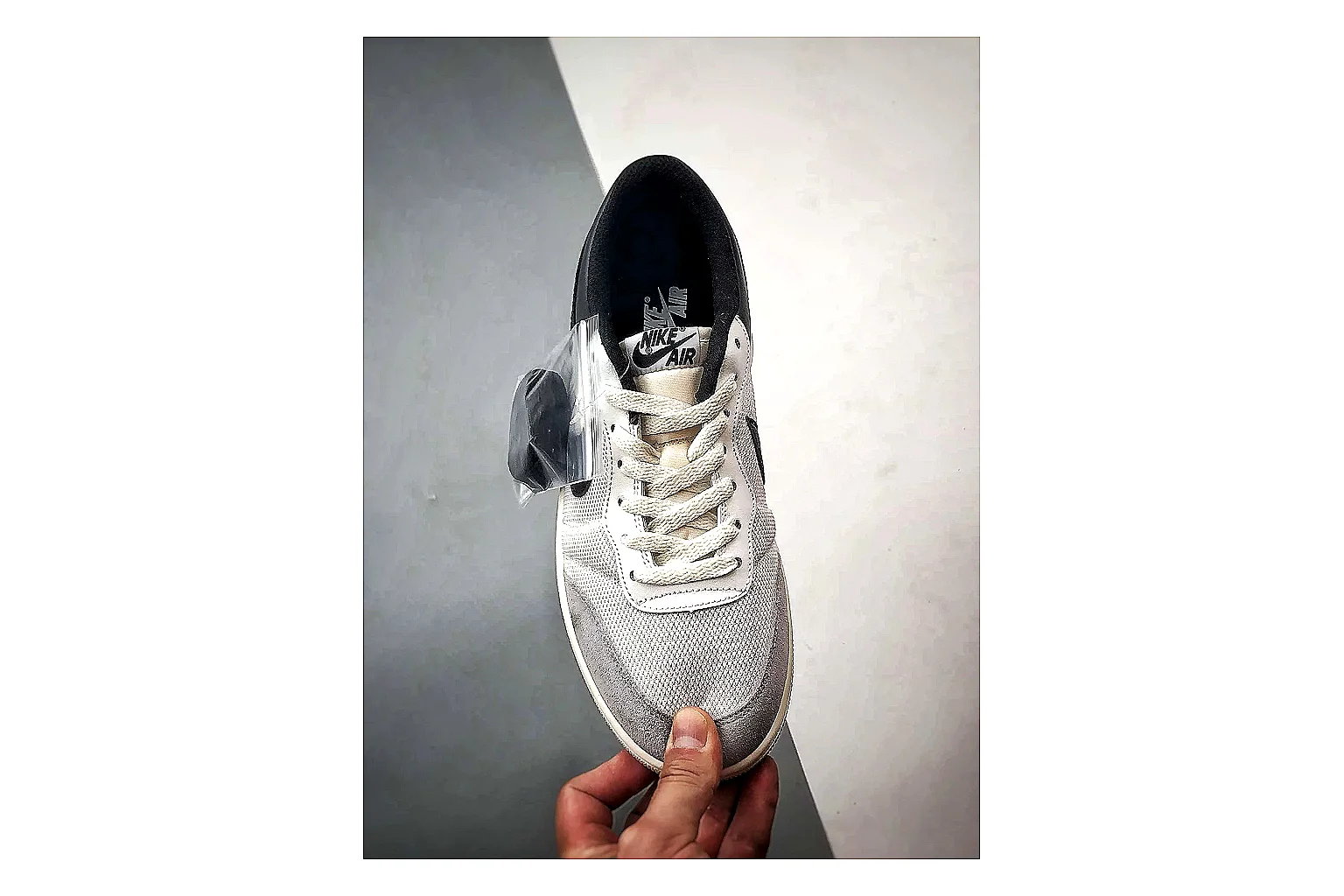 Jordan Low Black White Sneaker shopping brief image showing white black low-top sneaker with mixed-material upper and low-profile shape thumbnail 5