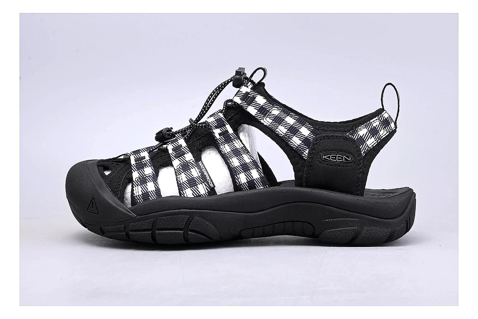 KEEN Zerraport Plaid Sandal shopping brief image showing white black plaid zerraport outdoor sandal with mixed upper and sandal shape