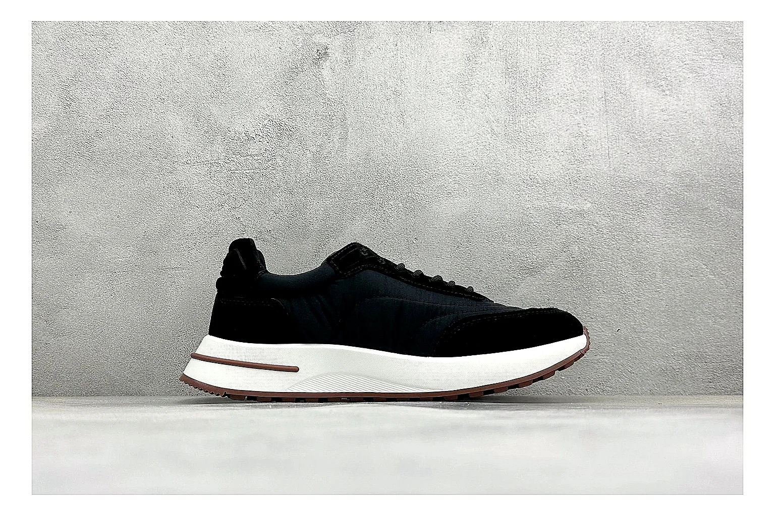 Loro Piana Week-End Black shopping brief image showing black suede upper, low casual profile, striped midsole accent, and soft everyday shape thumbnail 4
