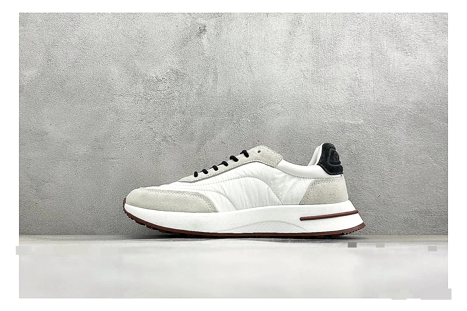 Loro Piana Week-End White shopping brief image showing white leather upper, gum outsole, low clean profile, and restrained casual detailing