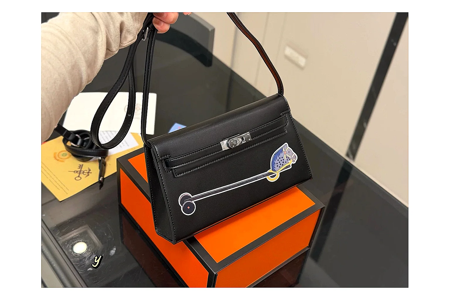 Louis Vuitton Wallet On Chain Black shopping brief photo showing black leather wallet-bag body, compact flap shape, chain strap, and polished LV-style hardware thumbnail 4