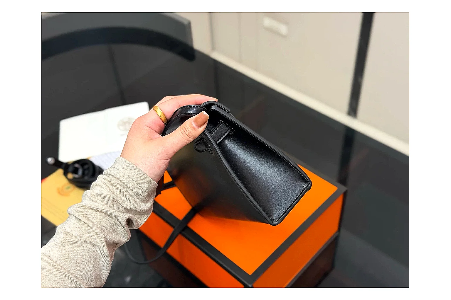 Louis Vuitton Wallet On Chain Black shopping brief photo showing black leather wallet-bag body, compact flap shape, chain strap, and polished LV-style hardware thumbnail 6