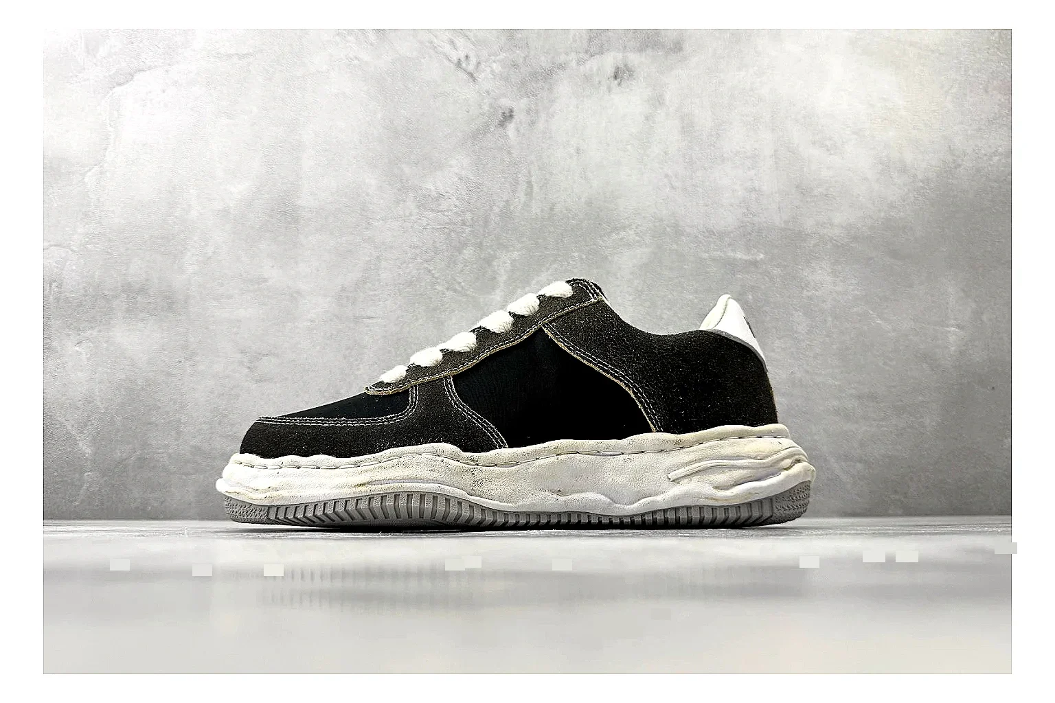 Maison Mihara Yasuhiro Blakey Black Distressed shopping brief photo showing black distressed canvas upper, warped sculpted white sole, low lace profile, and worn texture