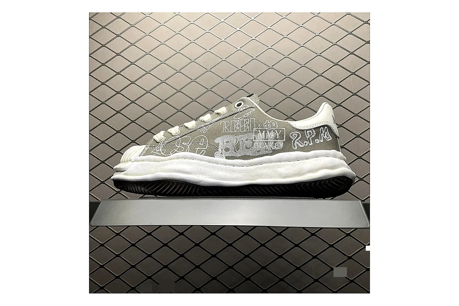 Maison Mihara Yasuhiro Blakey Grey shopping brief image showing white grey blakey distressed low-top with canvas upper and low top shape