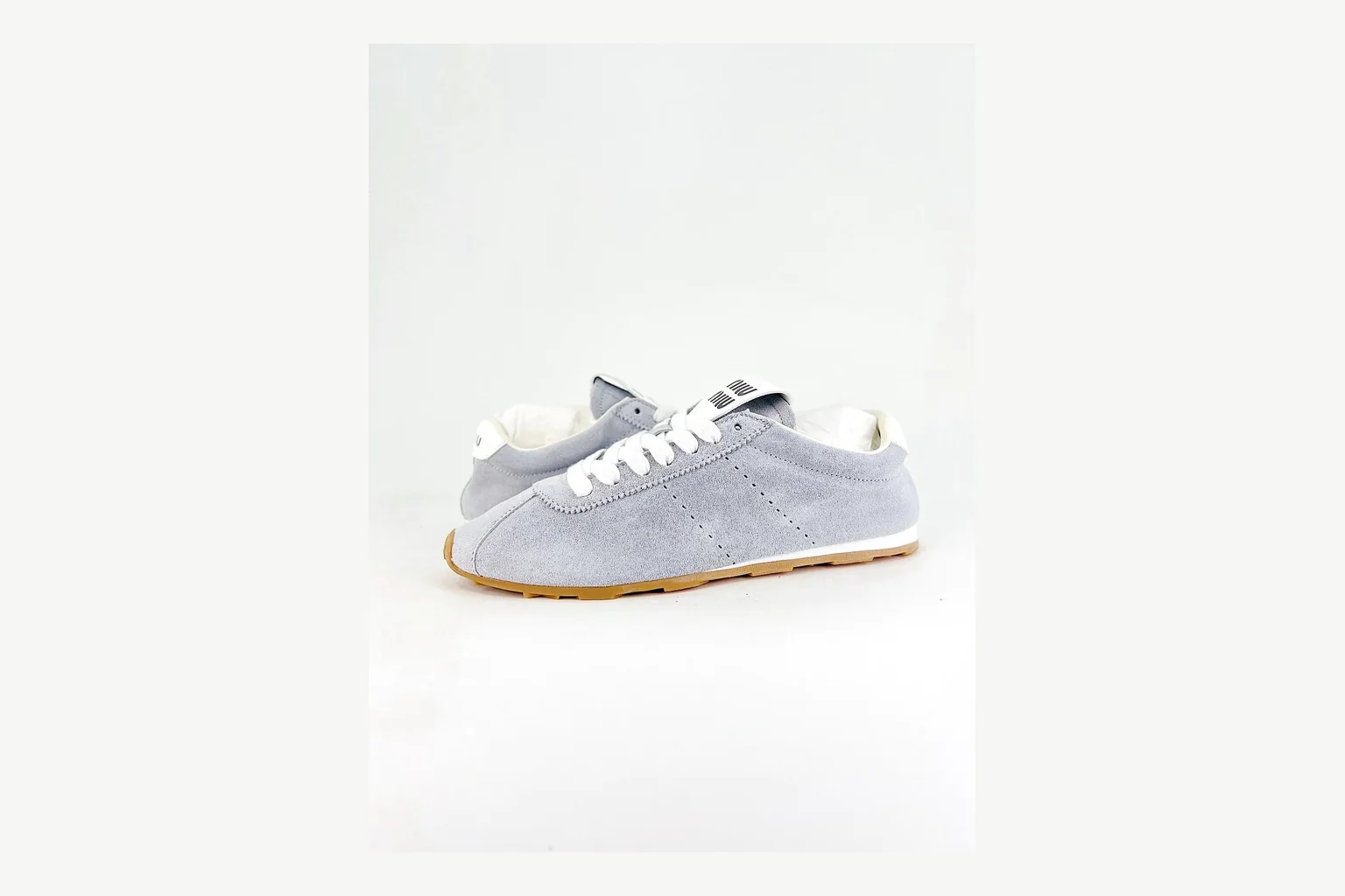 Miu Miu Grey Low Sneaker shopping brief image showing grey fashion low-top with mixed-material upper and low-profile shape