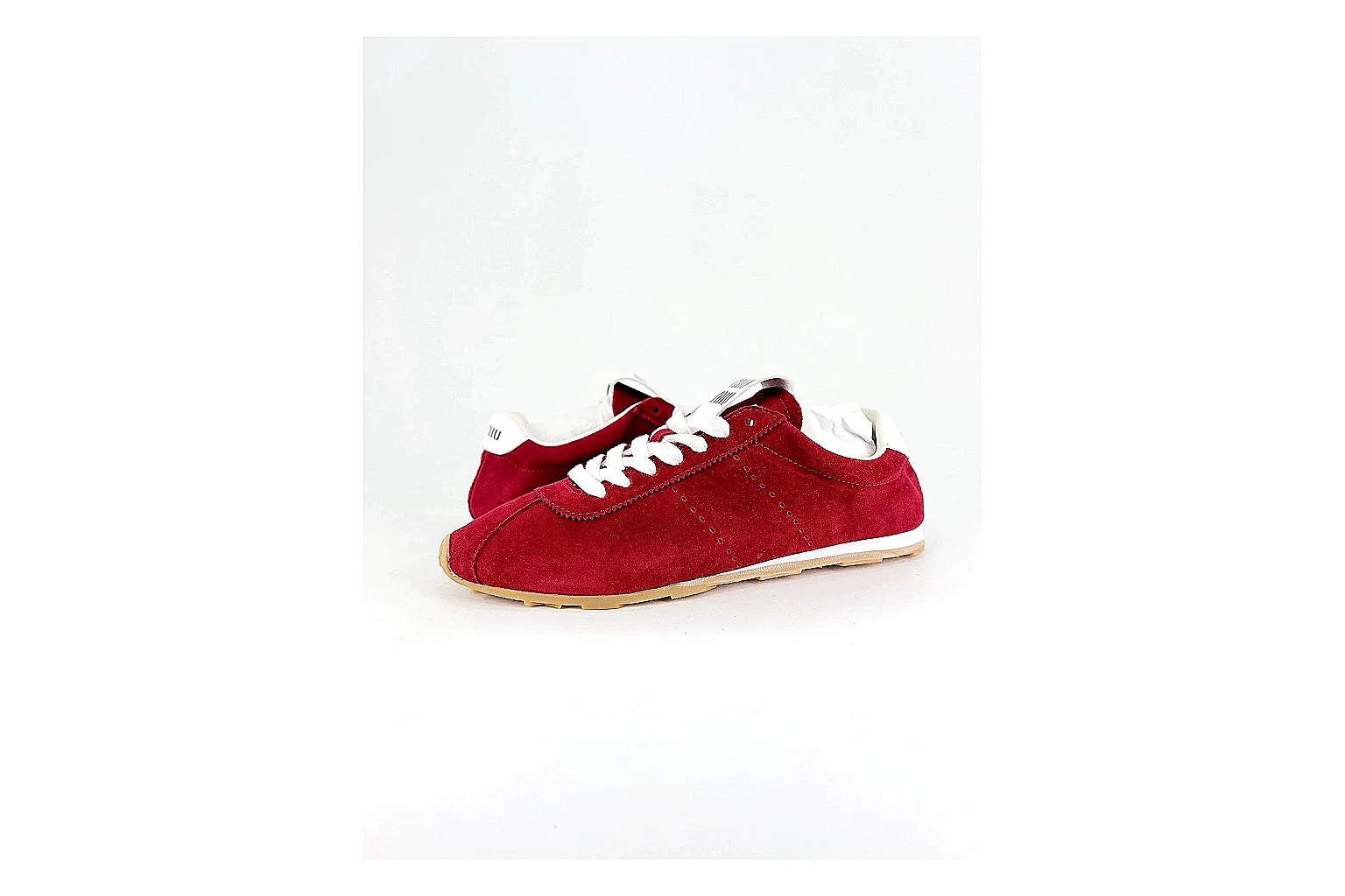 Miu Miu Red Suede Sneaker shopping brief image showing red fashion low-top with mixed-material upper and low-profile shape