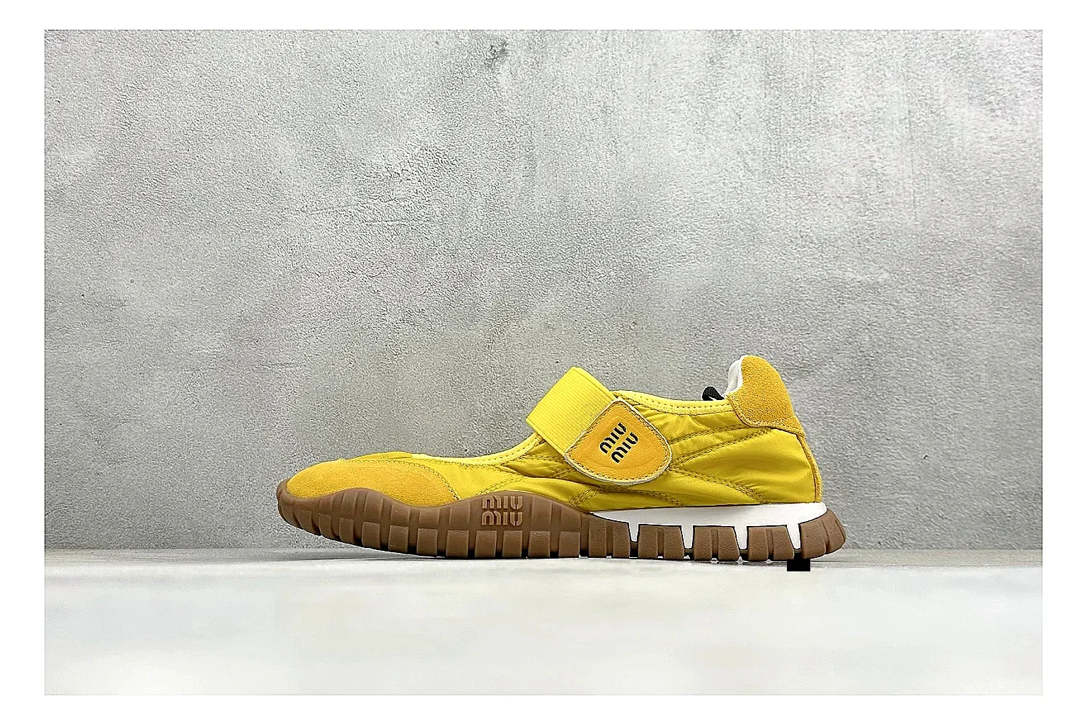 Miu Miu Tyre Yellow Mary Jane shopping brief photo showing yellow Mary Jane upper, strap closure, rugged Tyre outsole, and playful low-profile shape