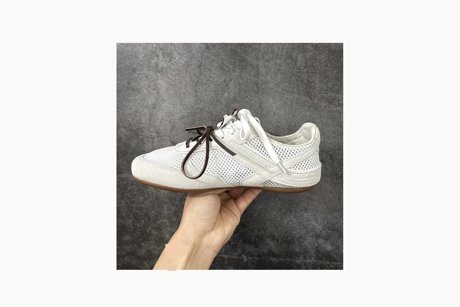 Miu Miu White Bow Sneaker shopping brief image showing white bow-detail low-top with mixed-material upper and low-profile shape