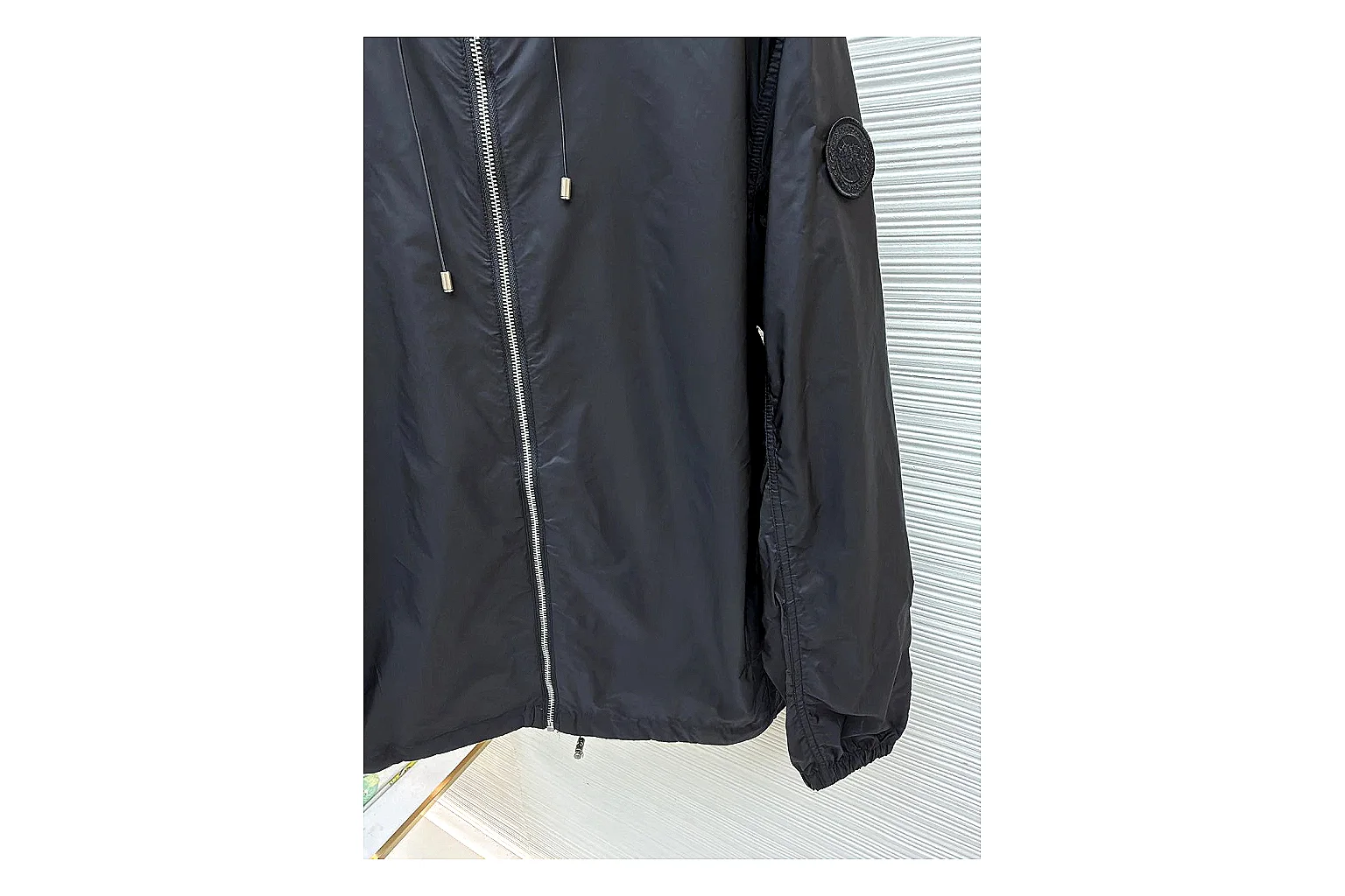 Moncler Nylon Hooded Jacket Black Jacket shopping brief image showing black nylon hooded jacket with nylon texture, hood structure, zipper line, sleeve cuffs, and light shell shape thumbnail 5