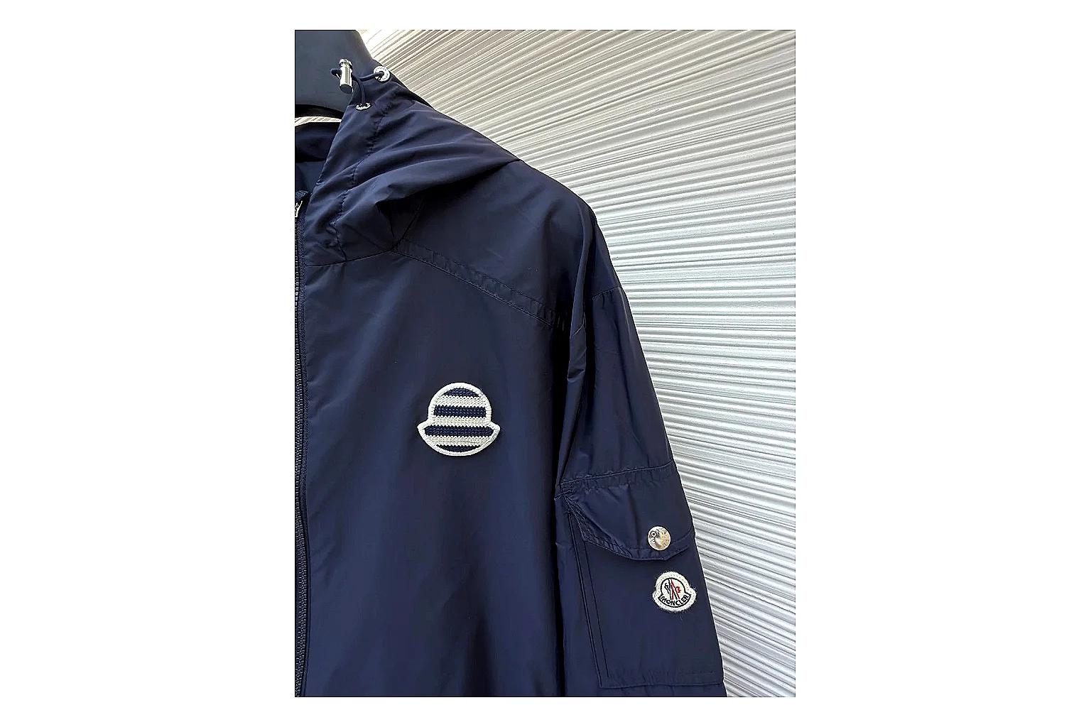 Moncler Nylon Hooded Jacket Navy Jacket shopping brief image showing navy nylon hooded jacket with nylon texture, hood structure, zipper line, sleeve cuffs, and light shell shape thumbnail 3